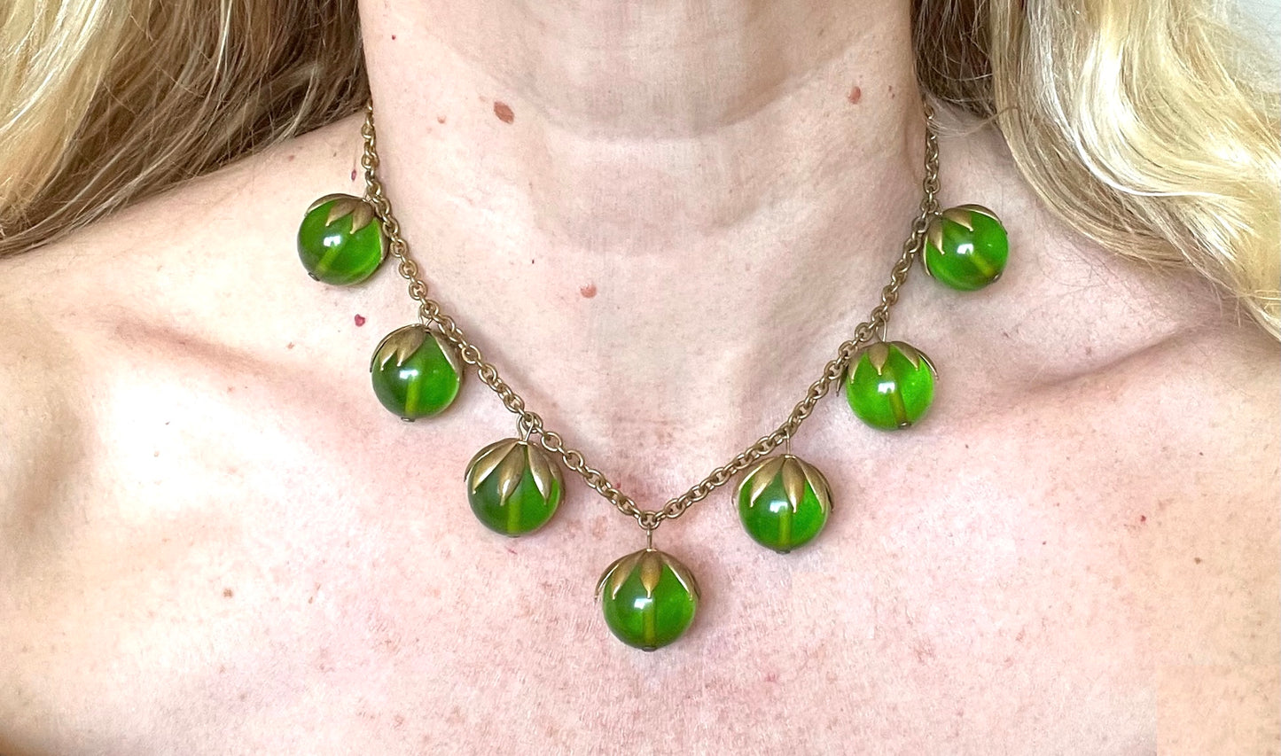 Vintage Art Deco 1930s machine age beaded fringe necklace with early plastic transparent green round chunky beads, antique gold tone links
