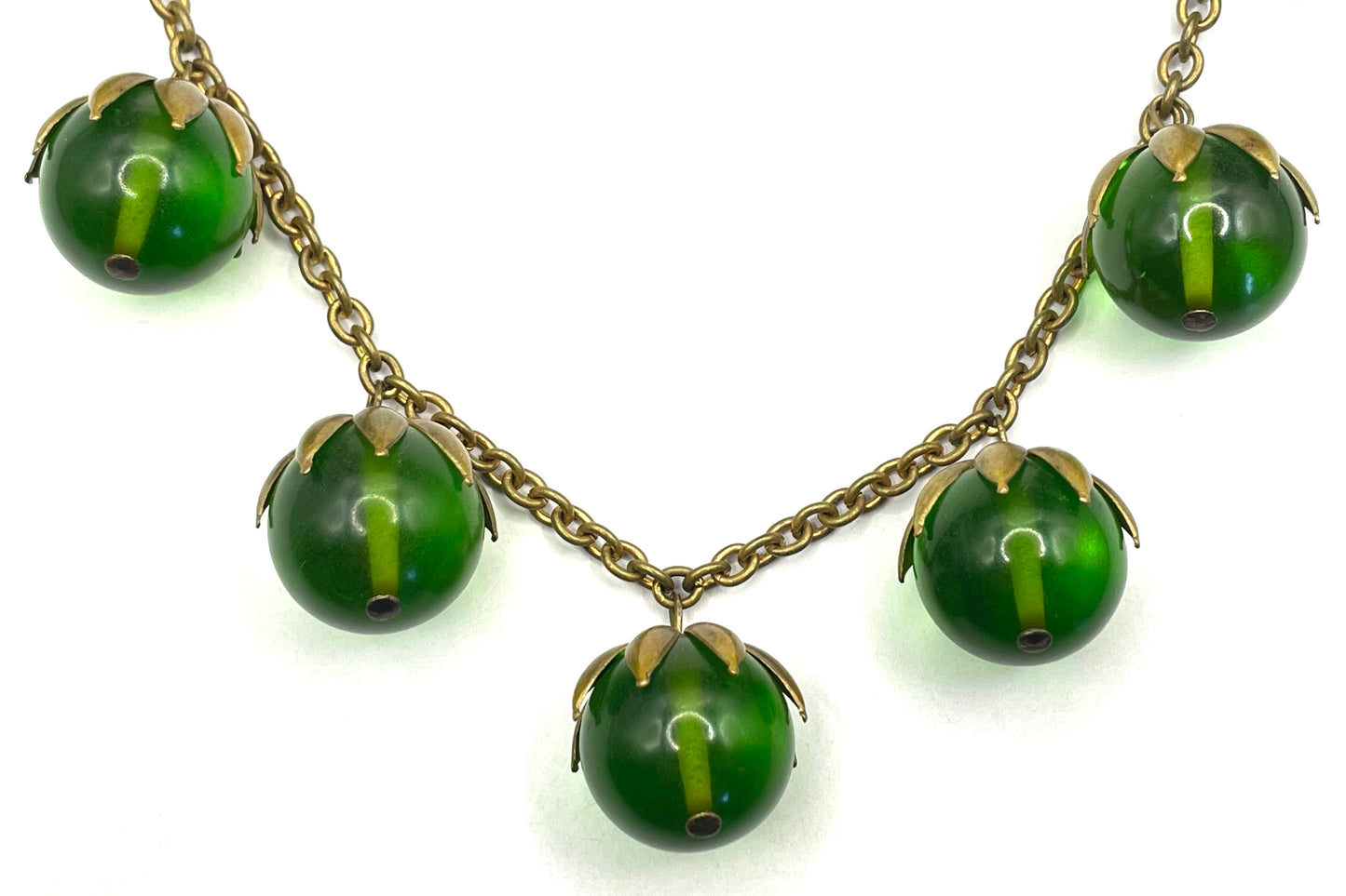 Vintage Art Deco 1930s machine age beaded fringe necklace with early plastic transparent green round chunky beads, antique gold tone links