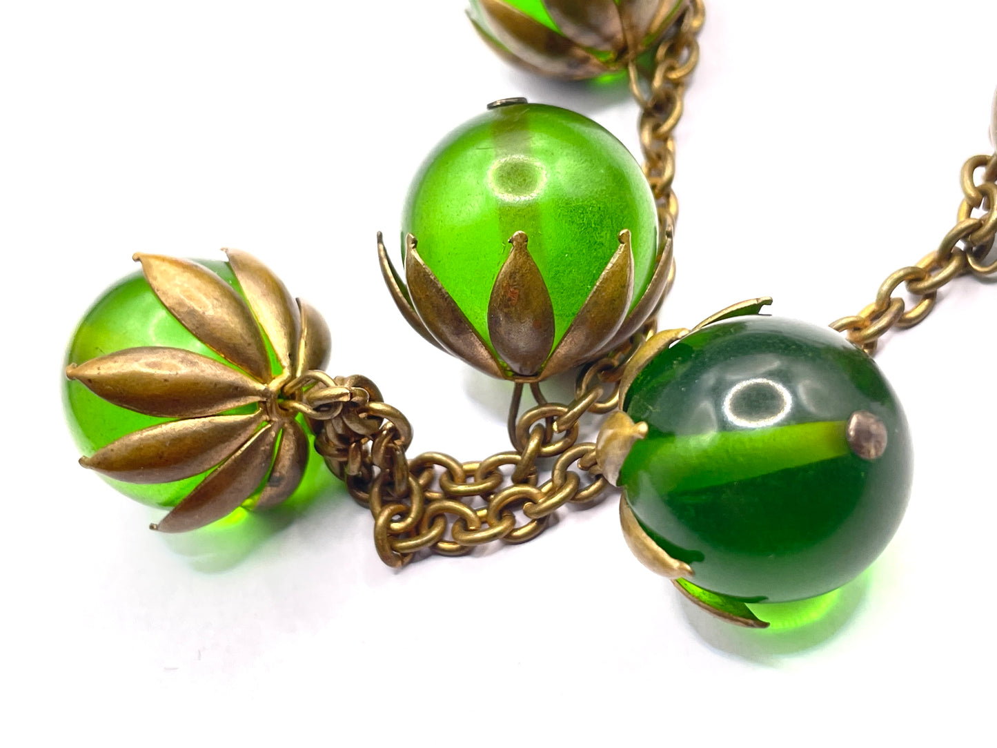 Vintage Art Deco 1930s machine age beaded fringe necklace with early plastic transparent green round chunky beads, antique gold tone links