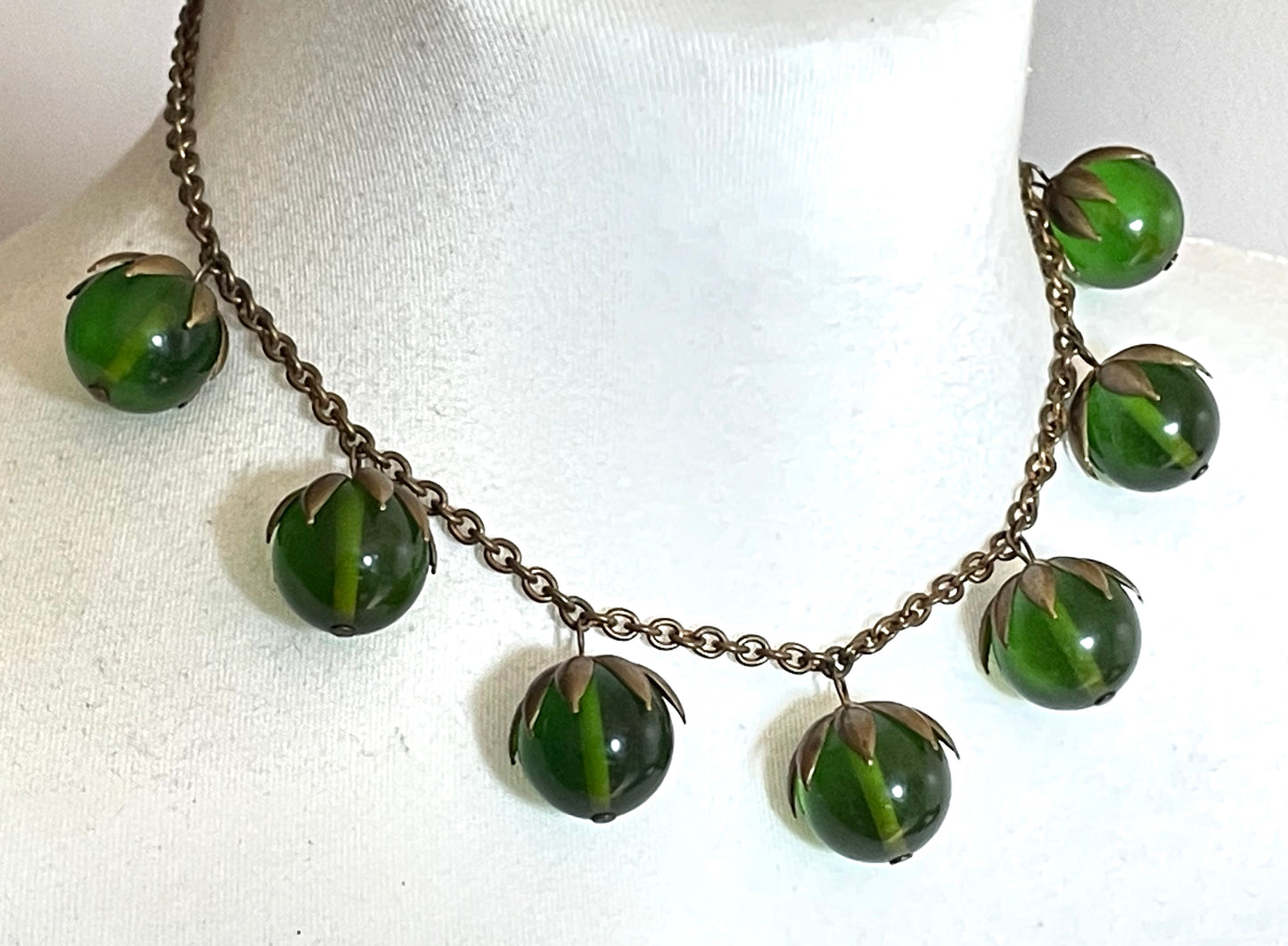 Vintage Art Deco 1930s machine age beaded fringe necklace with early plastic transparent green round chunky beads, antique gold tone links