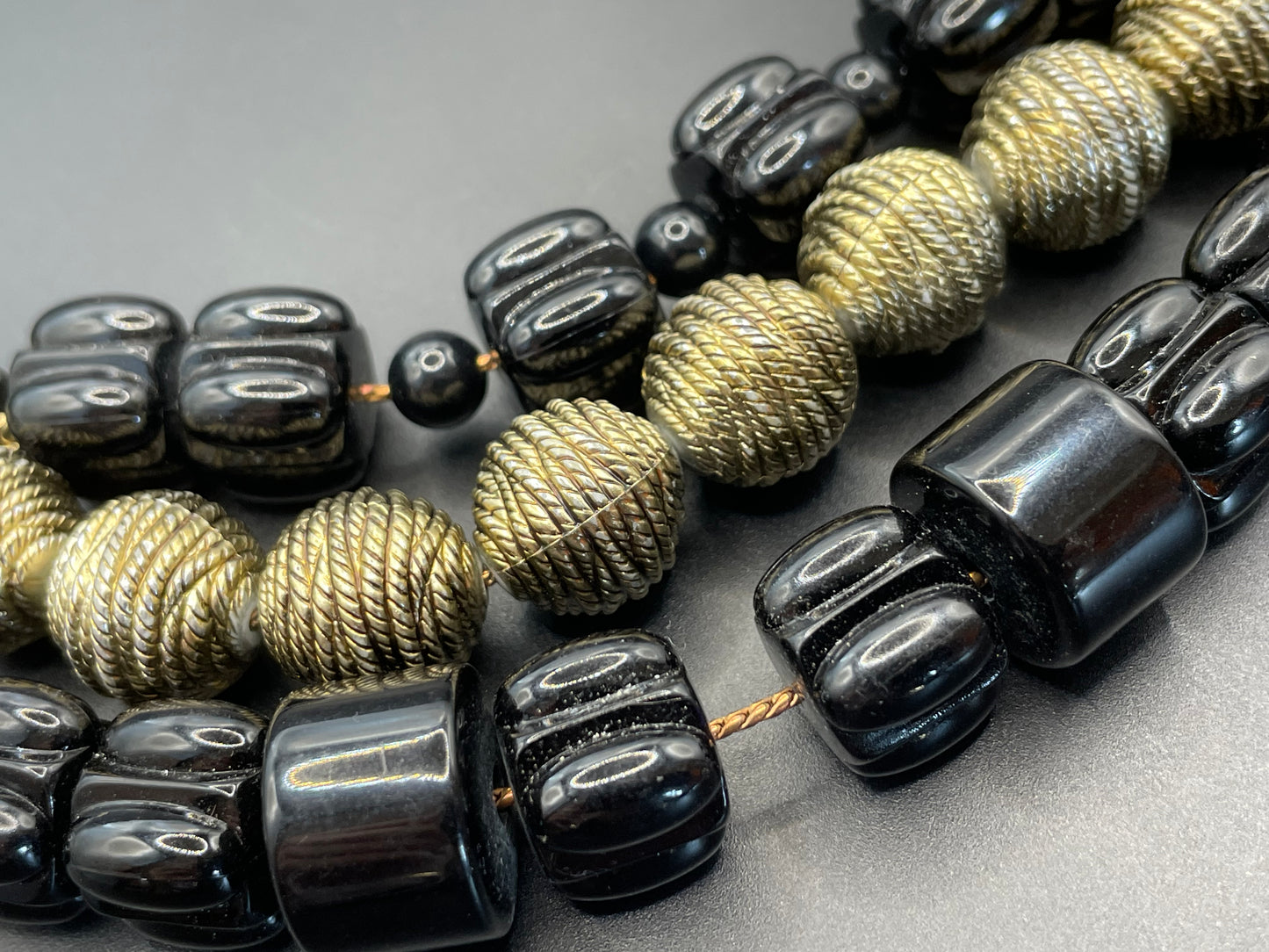 Vintage Christian Dior unsigned 1950s couture chunky early plastic and lucite black and gold beaded triple strand bib necklace