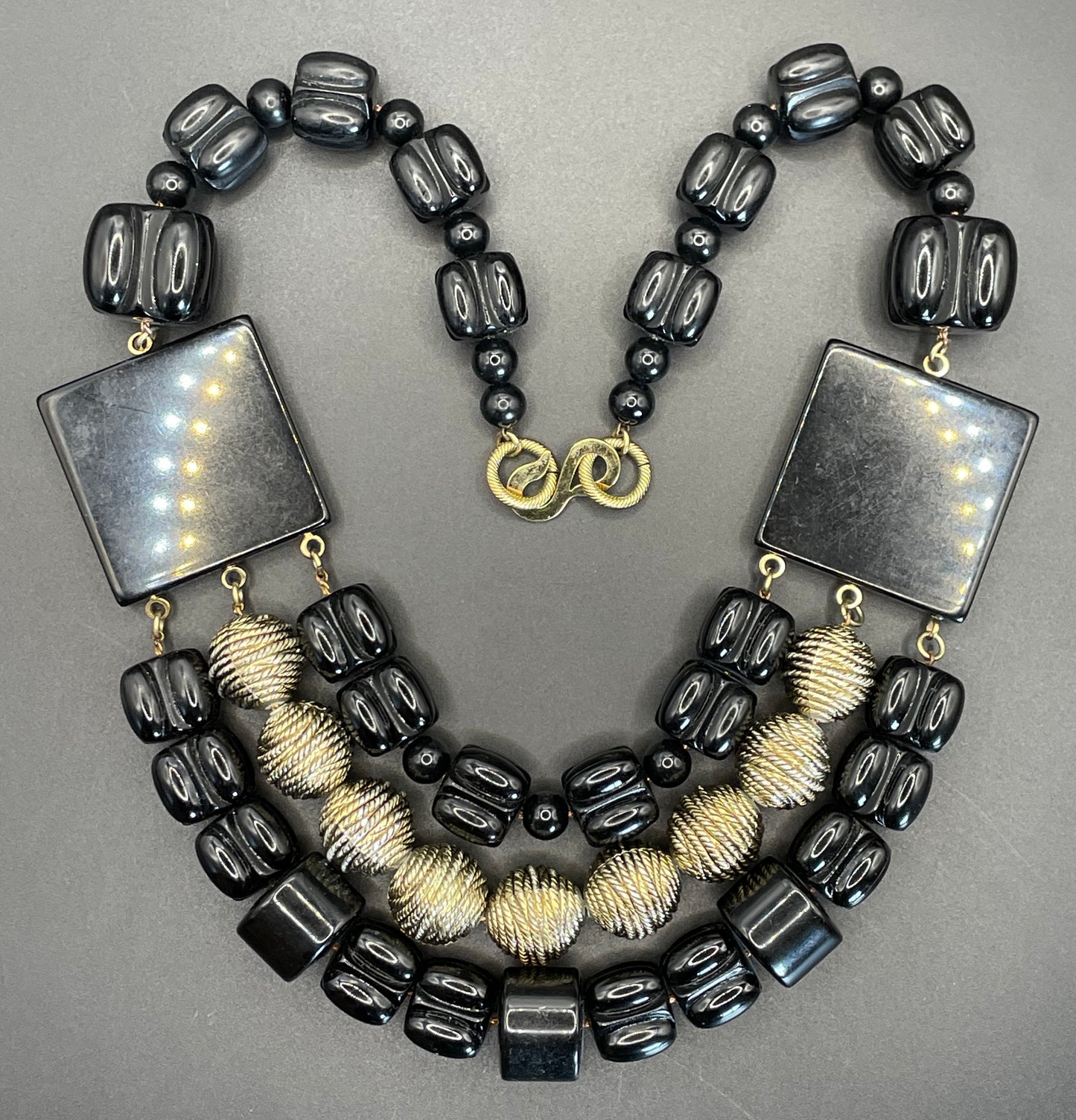 Vintage Christian Dior unsigned 1950s couture chunky early plastic and lucite black and gold beaded triple strand bib necklace