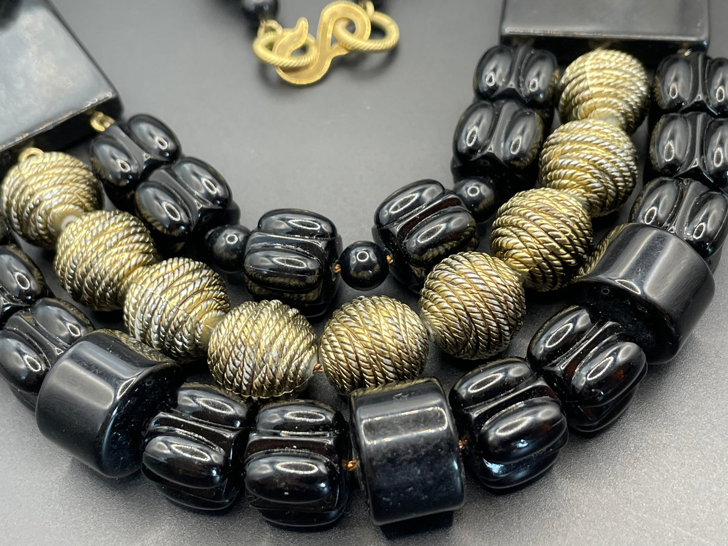 Vintage Christian Dior unsigned 1950s couture chunky early plastic and lucite black and gold beaded triple strand bib necklace