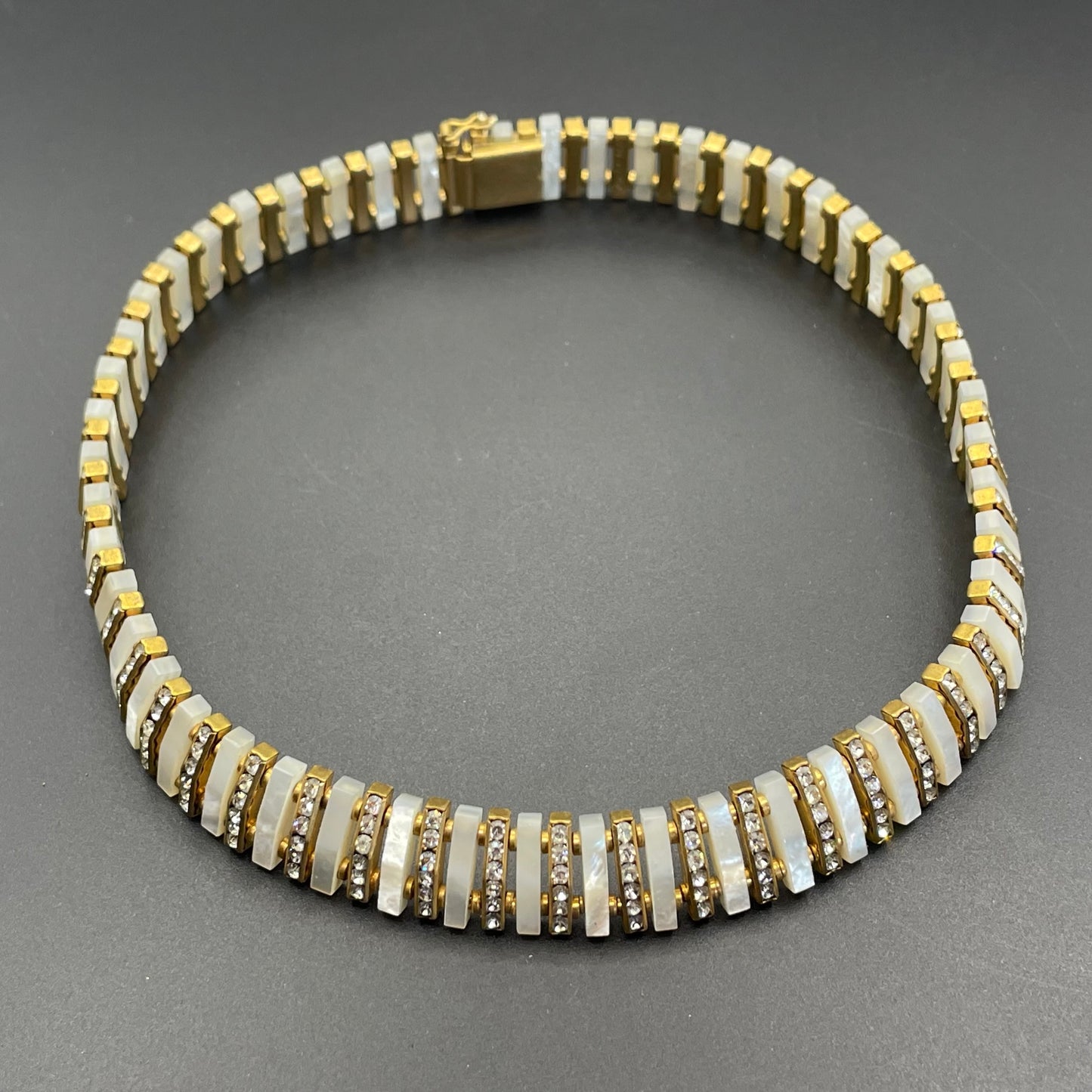 Vintage Schreiber and Hiller signed Esha Randel Art Deco clear rhinestone, carved mother of pearl (MOP) and gold tone choker necklace