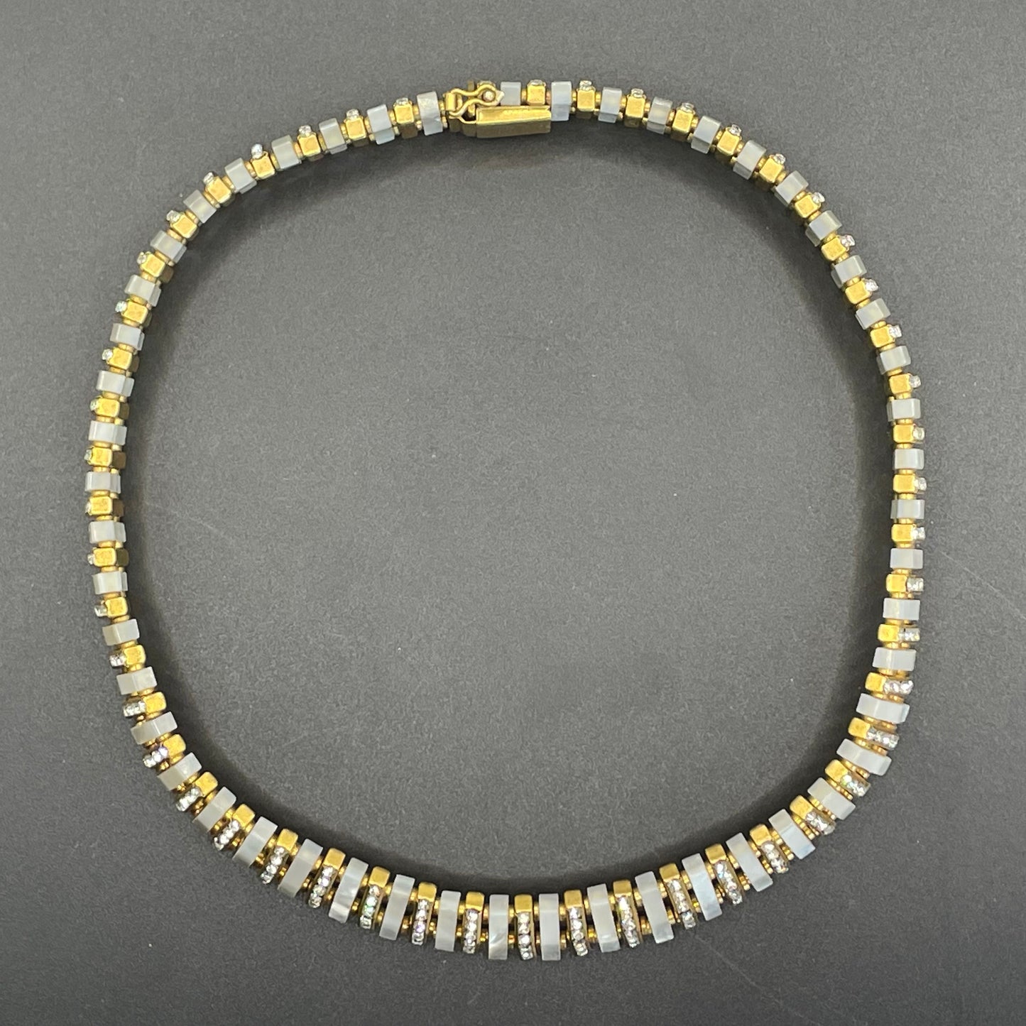Vintage Schreiber and Hiller signed Esha Randel Art Deco clear rhinestone, carved mother of pearl (MOP) and gold tone choker necklace