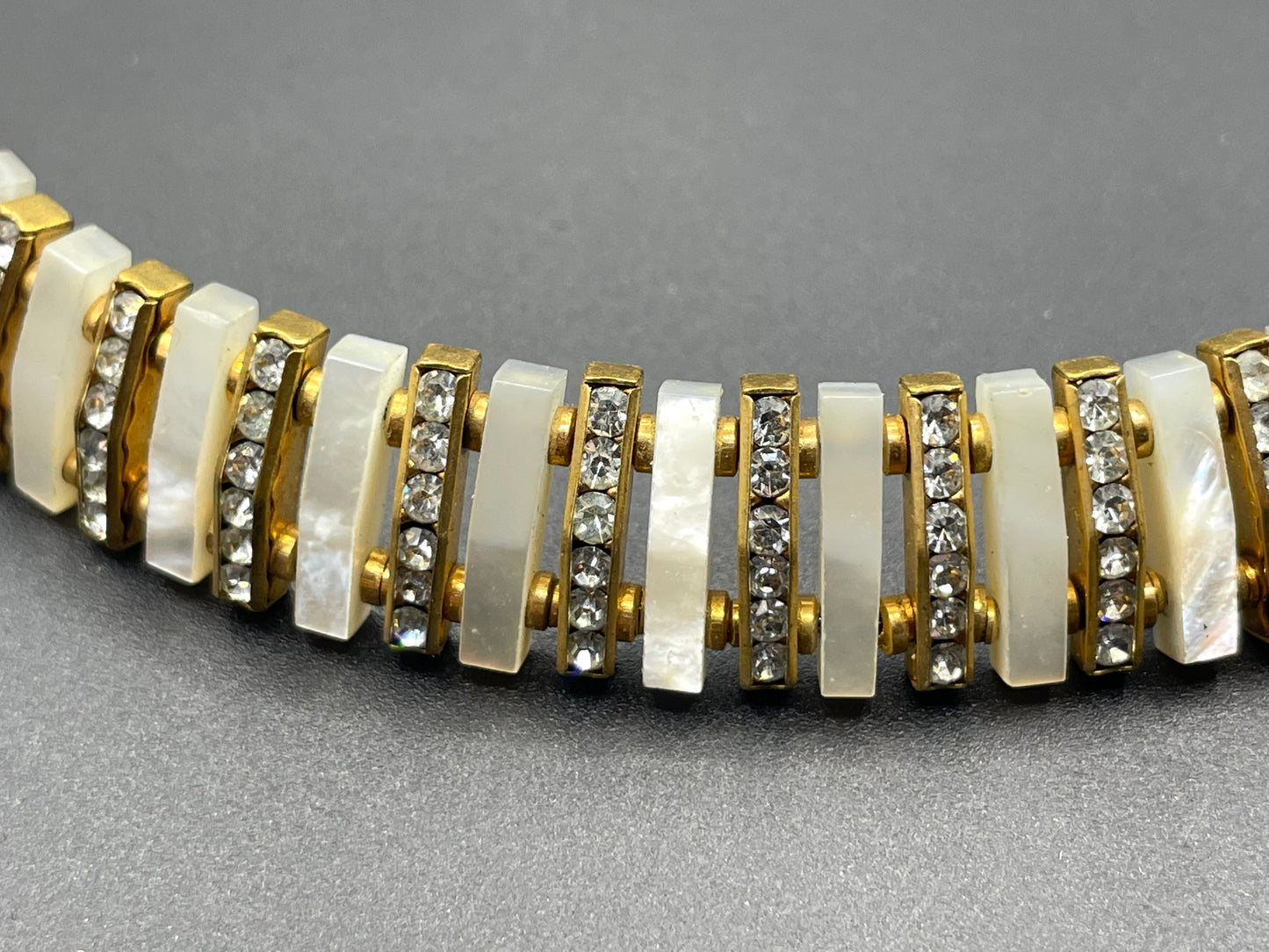 Vintage Schreiber and Hiller signed Esha Randel Art Deco clear rhinestone, carved mother of pearl (MOP) and gold tone choker necklace