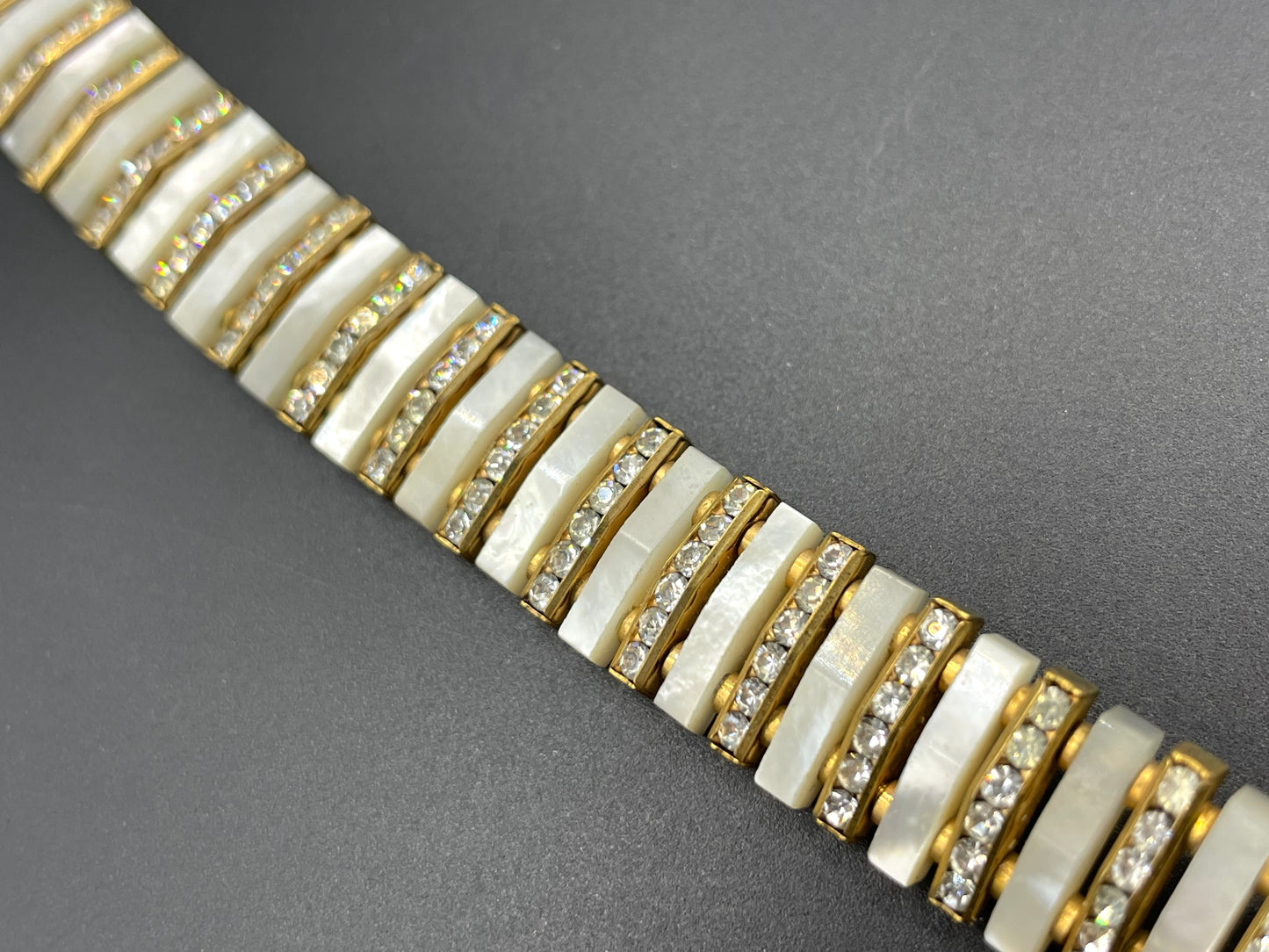 Vintage Schreiber and Hiller signed Esha Randel Art Deco clear rhinestone, carved mother of pearl (MOP) and gold tone choker necklace