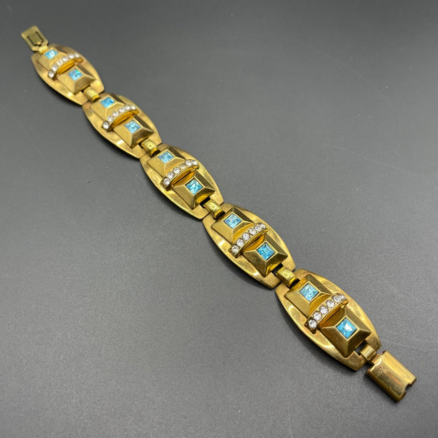 Vintage Art Deco clear and turquoise blue paste rhinestone and gold tone geometric panel bracelet
