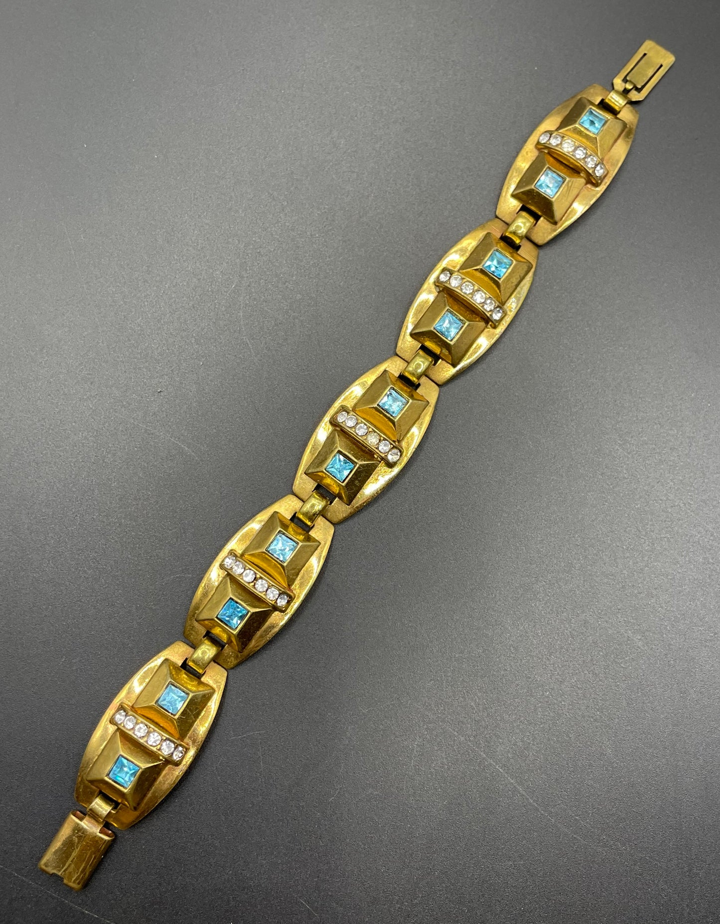 Vintage Art Deco clear and turquoise blue paste rhinestone and gold tone geometric panel bracelet