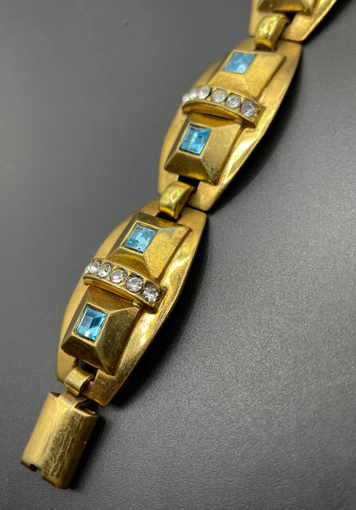 Vintage Art Deco clear and turquoise blue paste rhinestone and gold tone geometric panel bracelet