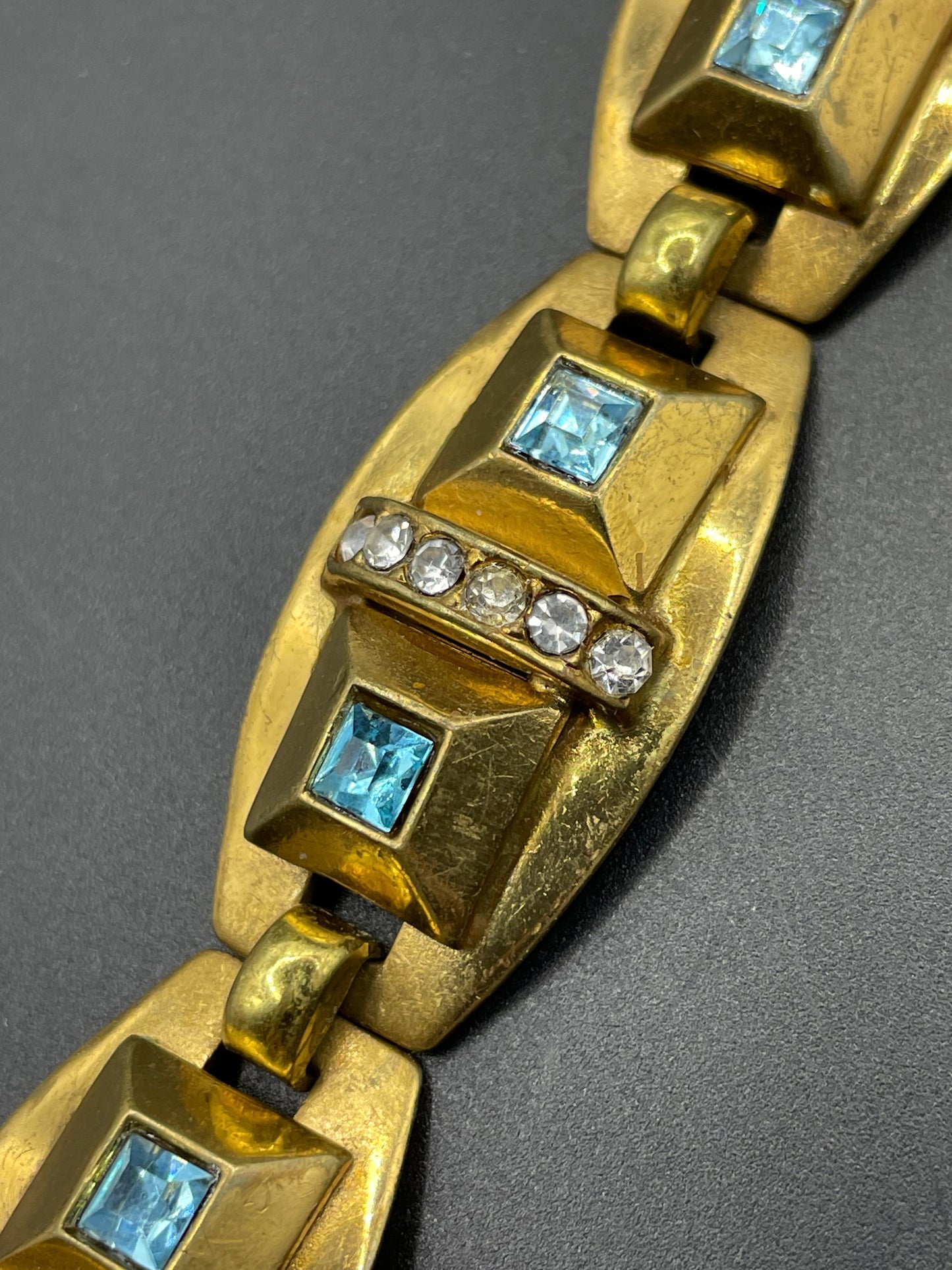Vintage Art Deco clear and turquoise blue paste rhinestone and gold tone geometric panel bracelet