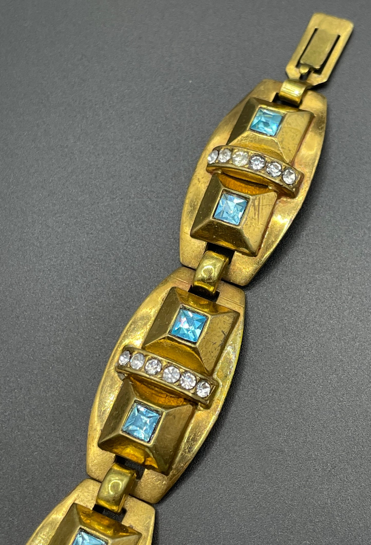Vintage Art Deco clear and turquoise blue paste rhinestone and gold tone geometric panel bracelet