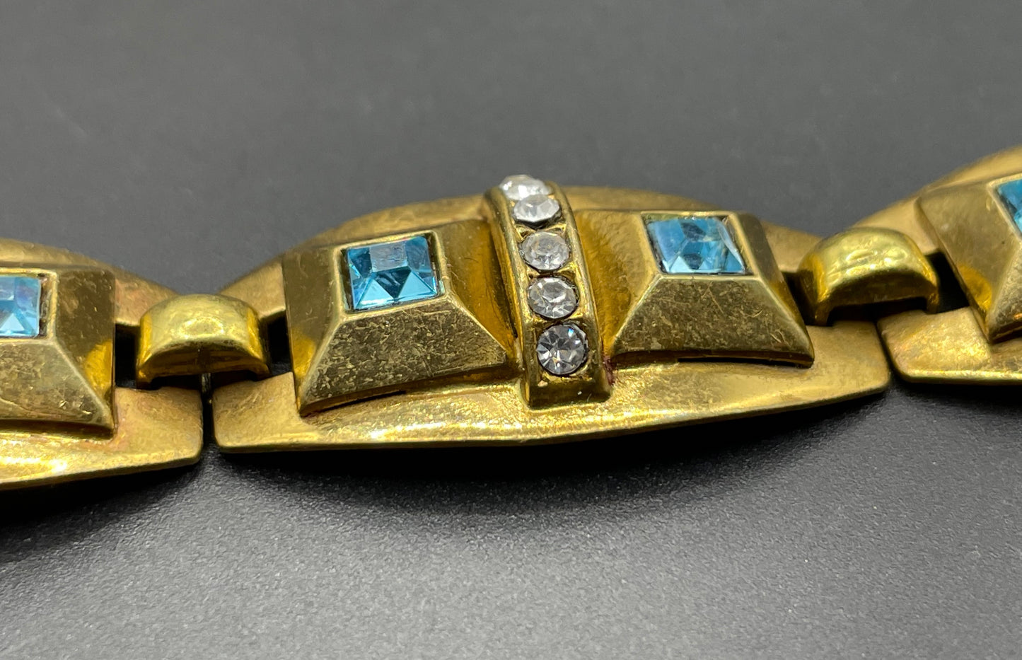 Vintage Art Deco clear and turquoise blue paste rhinestone and gold tone geometric panel bracelet