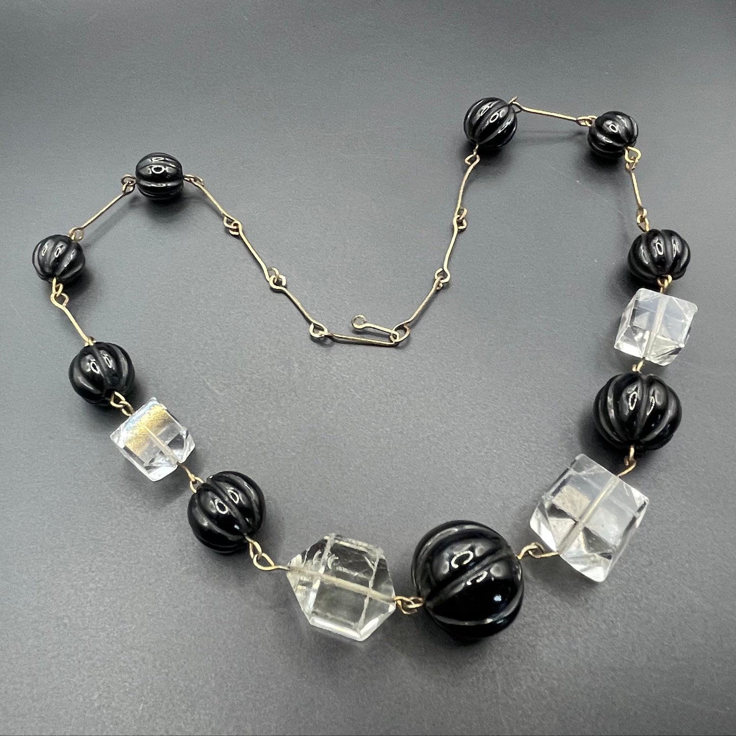 Vintage Art Deco chunky clear crystal faceted bead and carved early plastic melon / pumpkin bead necklace, with rolled gold wires