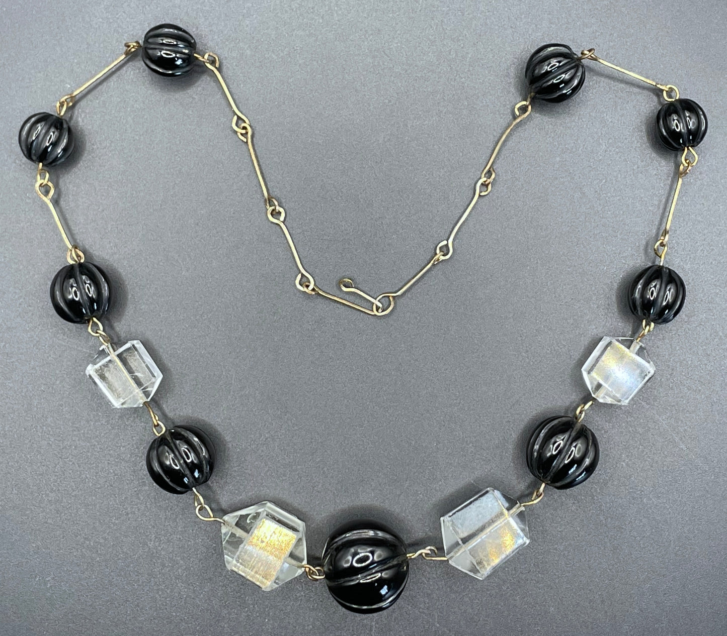 Vintage Art Deco chunky clear crystal faceted bead and carved early plastic melon / pumpkin bead necklace, with rolled gold wires
