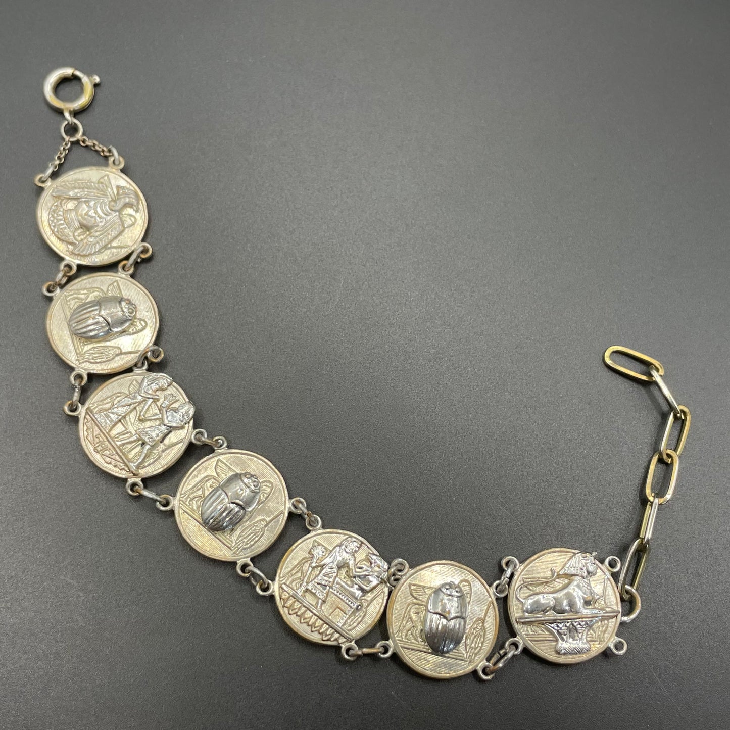 Vintage Egyptian revival scarab, pharaoh and hieroglyphics design silver tone circular panel bracelet, rubbing to silver tone