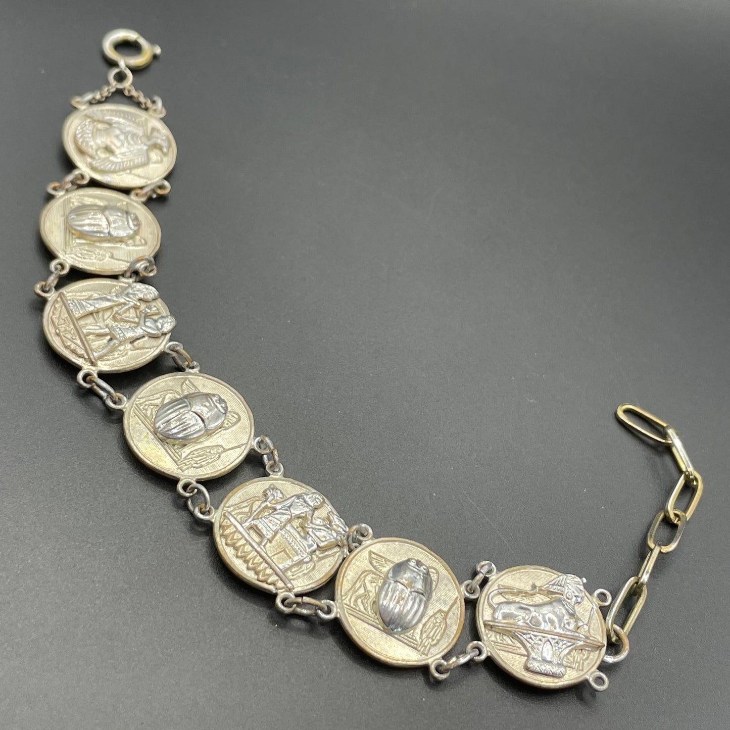 Vintage Egyptian revival scarab, pharaoh and hieroglyphics design silver tone circular panel bracelet, rubbing to silver tone