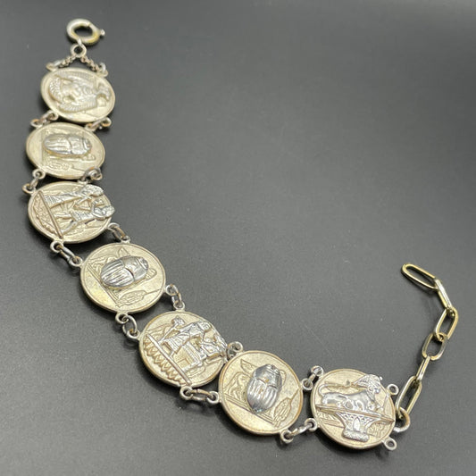 Vintage Egyptian revival scarab, pharaoh and hieroglyphics design silver tone circular panel bracelet, rubbing to silver tone