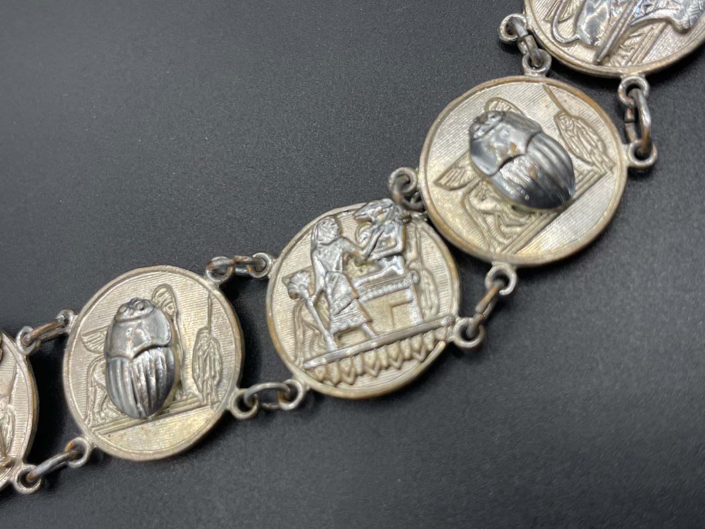 Vintage Egyptian revival scarab, pharaoh and hieroglyphics design silver tone circular panel bracelet, rubbing to silver tone
