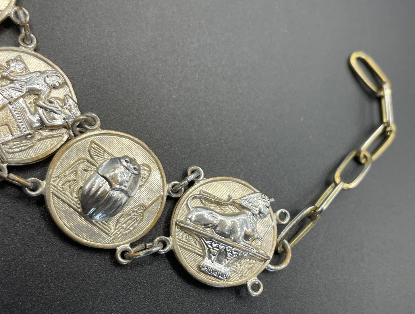 Vintage Egyptian revival scarab, pharaoh and hieroglyphics design silver tone circular panel bracelet, rubbing to silver tone