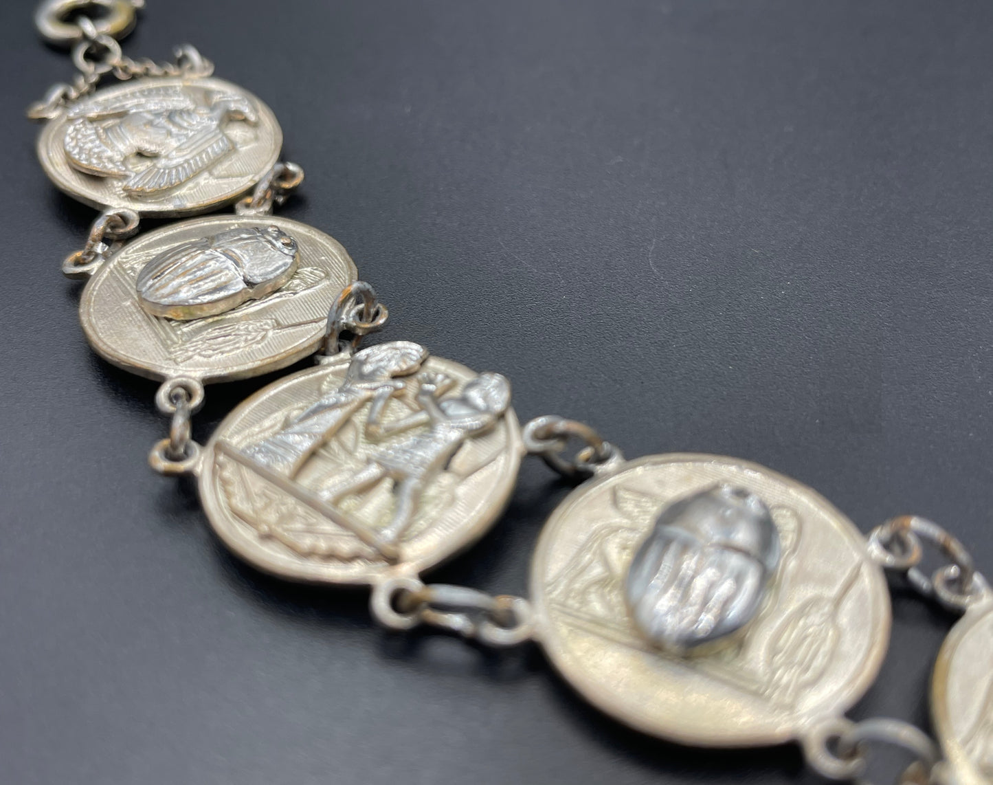 Vintage Egyptian revival scarab, pharaoh and hieroglyphics design silver tone circular panel bracelet, rubbing to silver tone