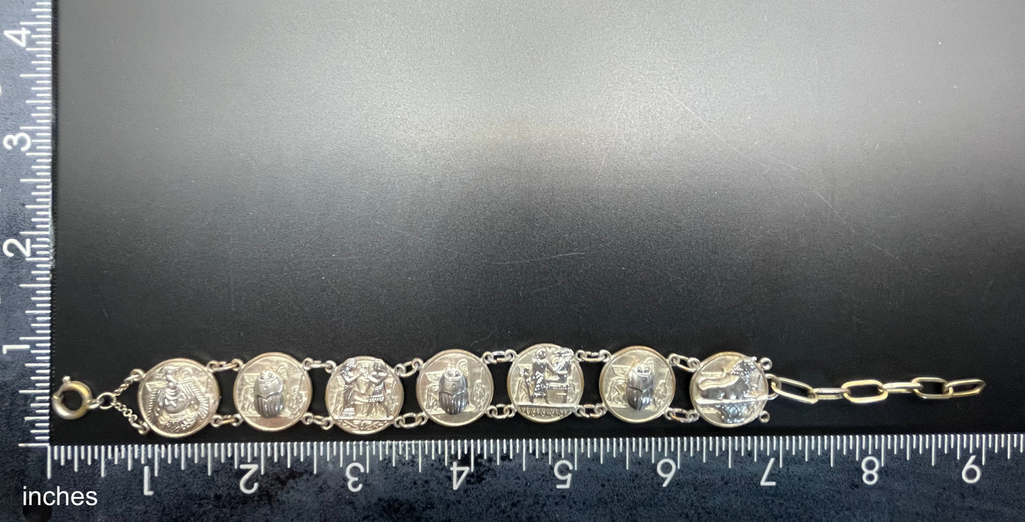 Vintage Egyptian revival scarab, pharaoh and hieroglyphics design silver tone circular panel bracelet, rubbing to silver tone