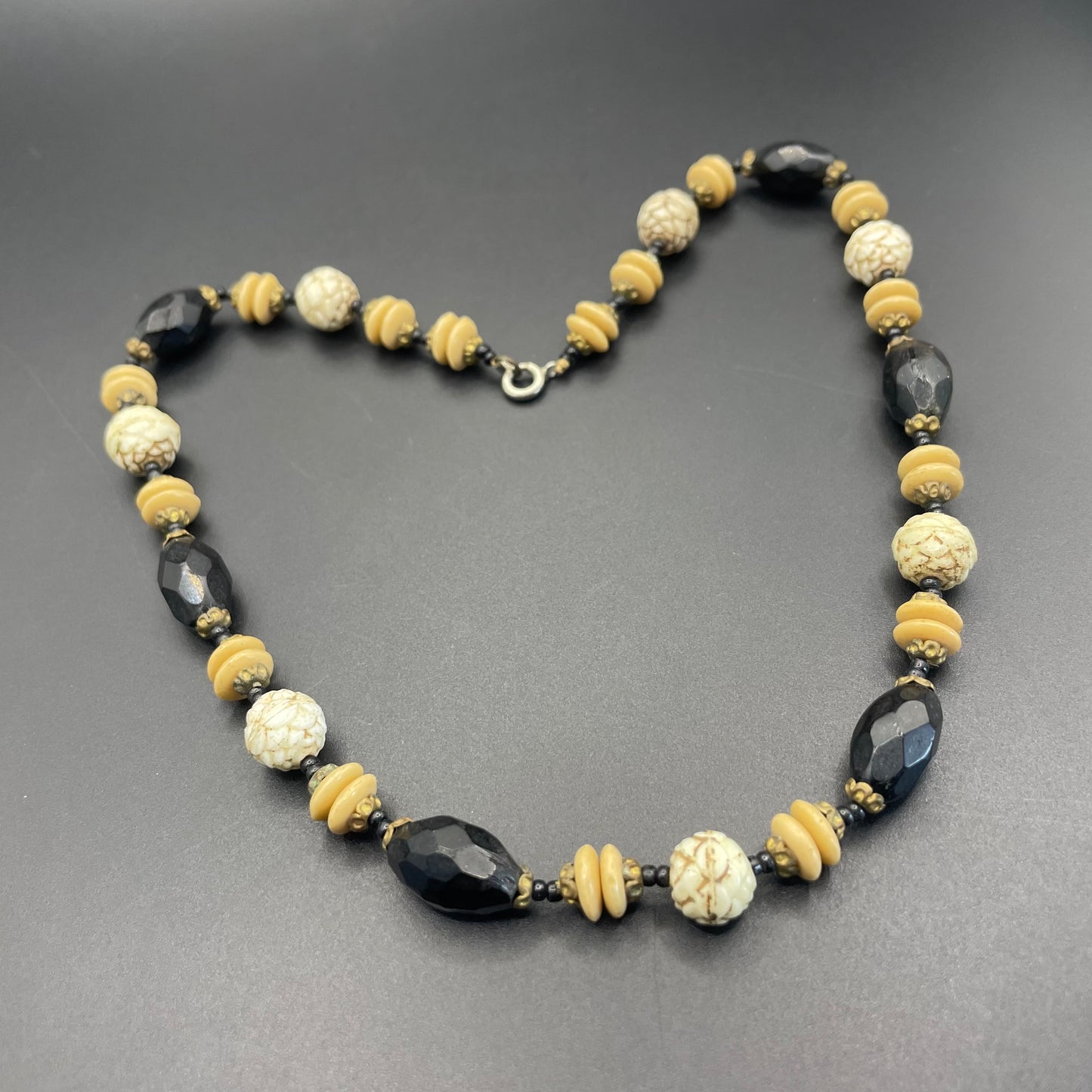 Vintage Art Deco Czech glass bead necklace, moulded glass and faceted glass beads in black, cream and white uranium glass