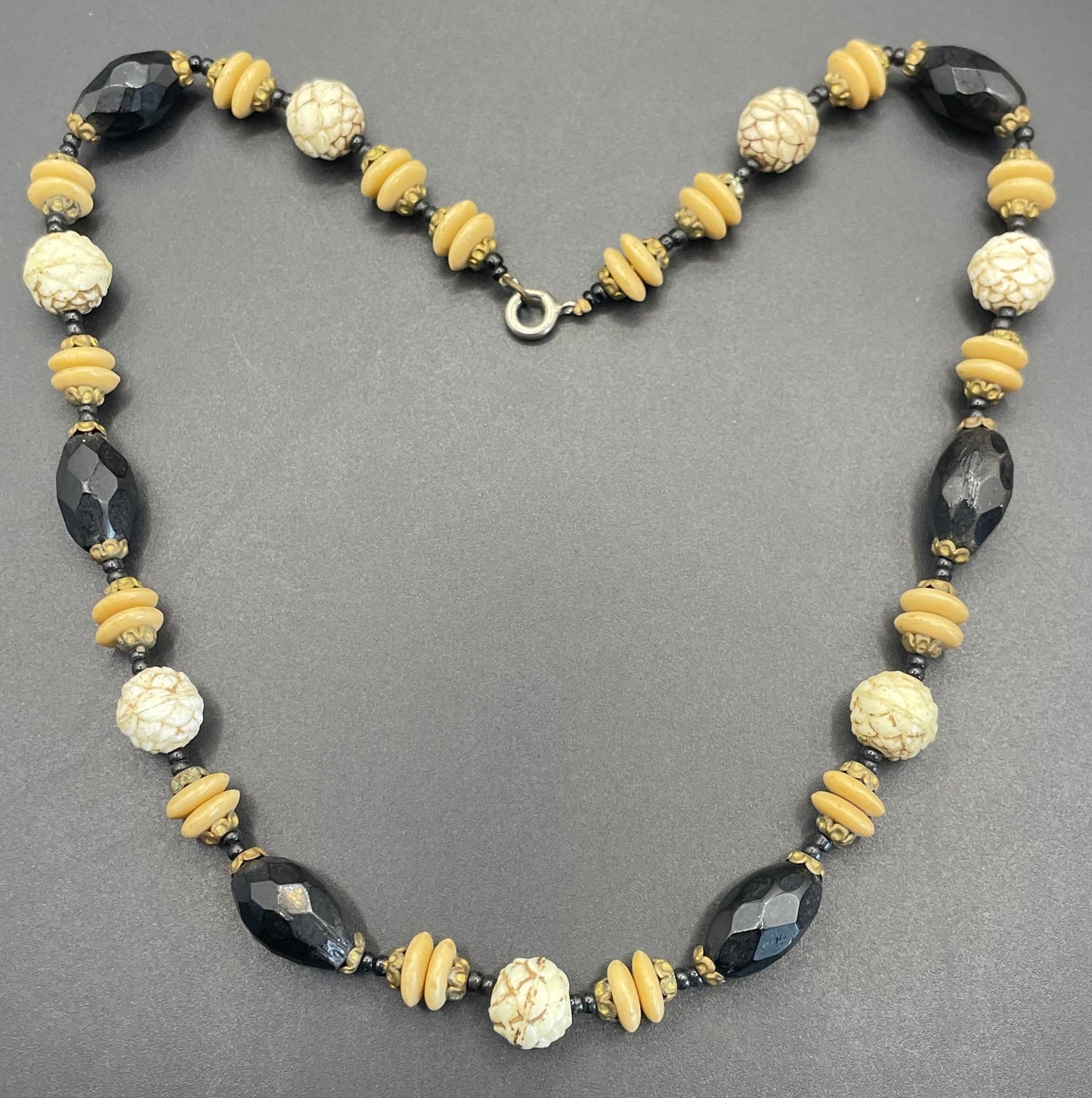 Vintage Art Deco Czech glass bead necklace, moulded glass and faceted glass beads in black, cream and white uranium glass