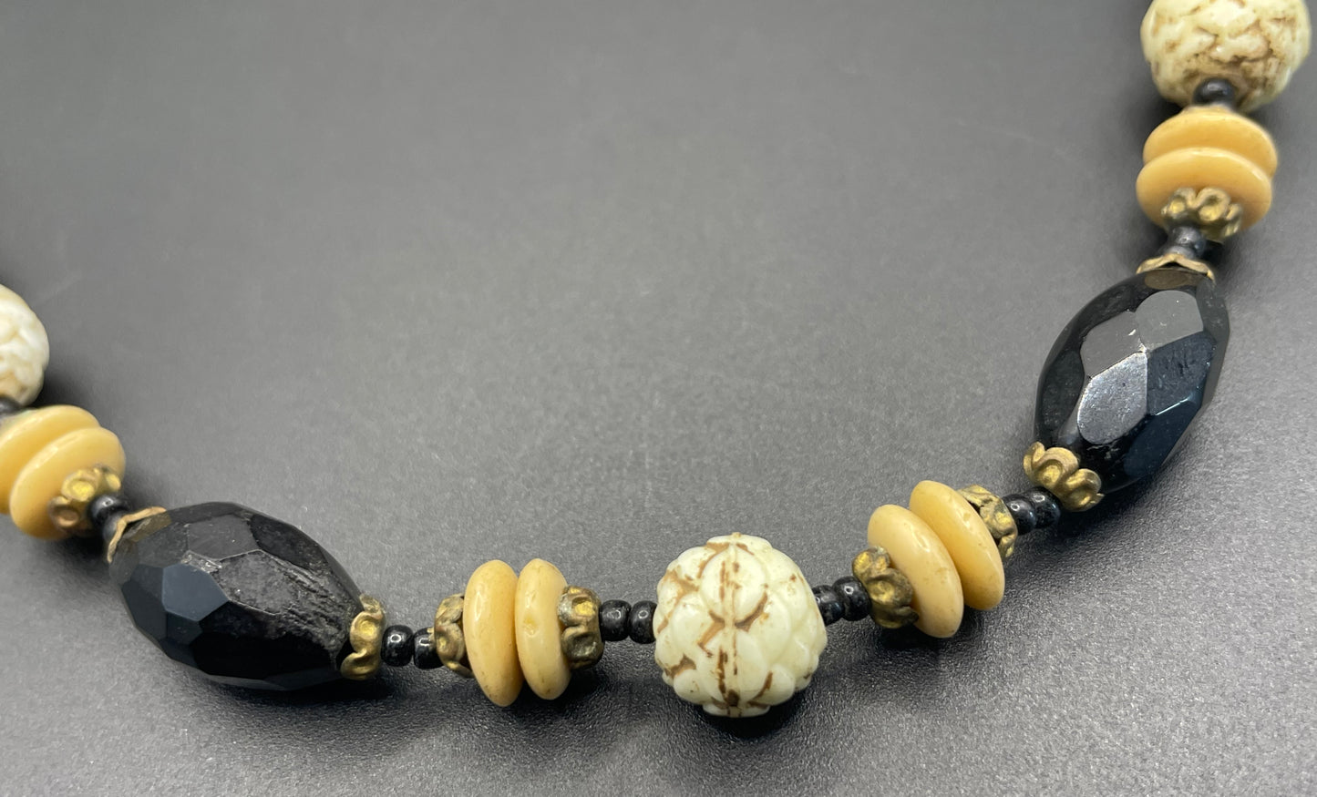 Vintage Art Deco Czech glass bead necklace, moulded glass and faceted glass beads in black, cream and white uranium glass