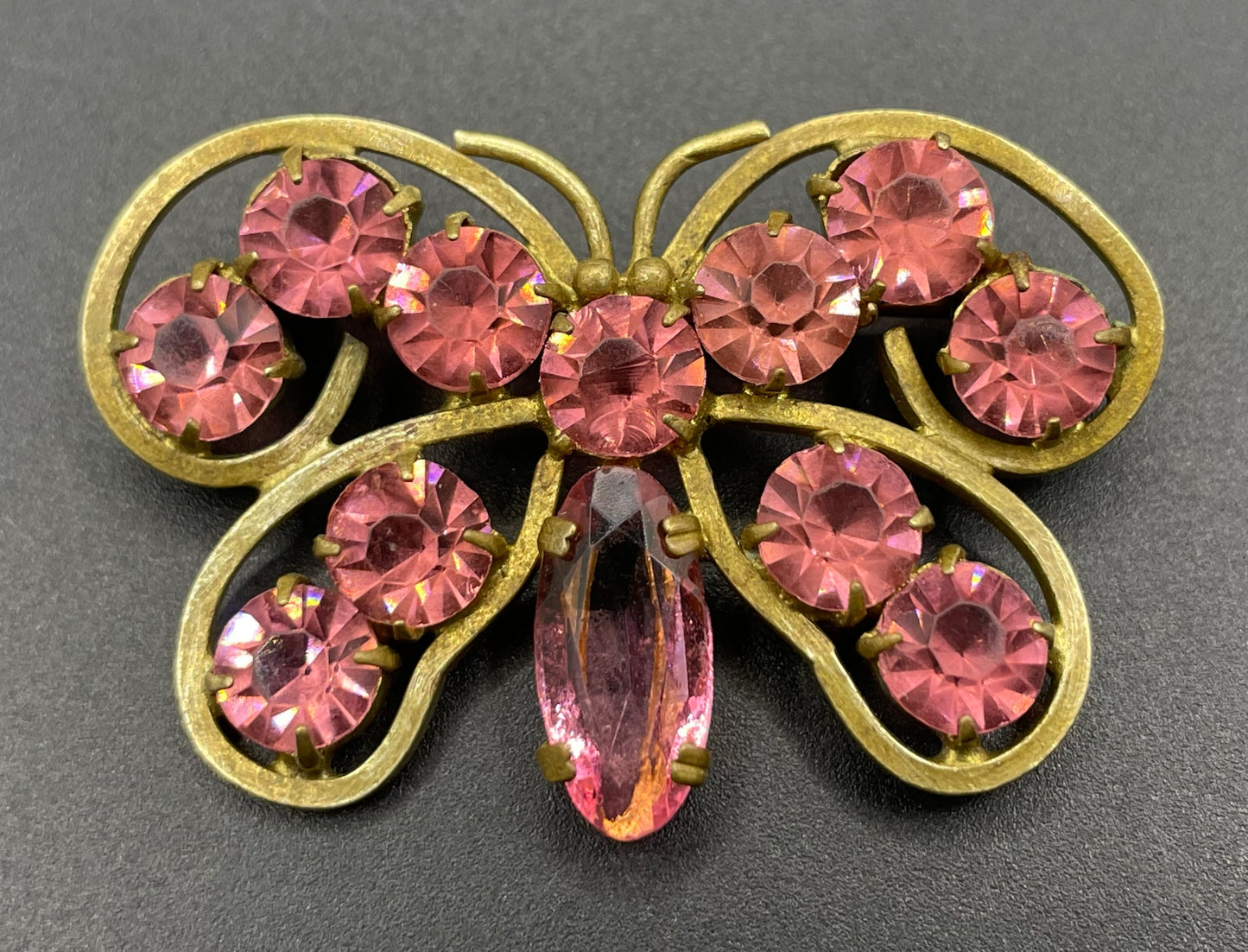 Vintage Art Deco Czech butterfly brooch, pink glass rhinestones, set open-backed in antique gold tone