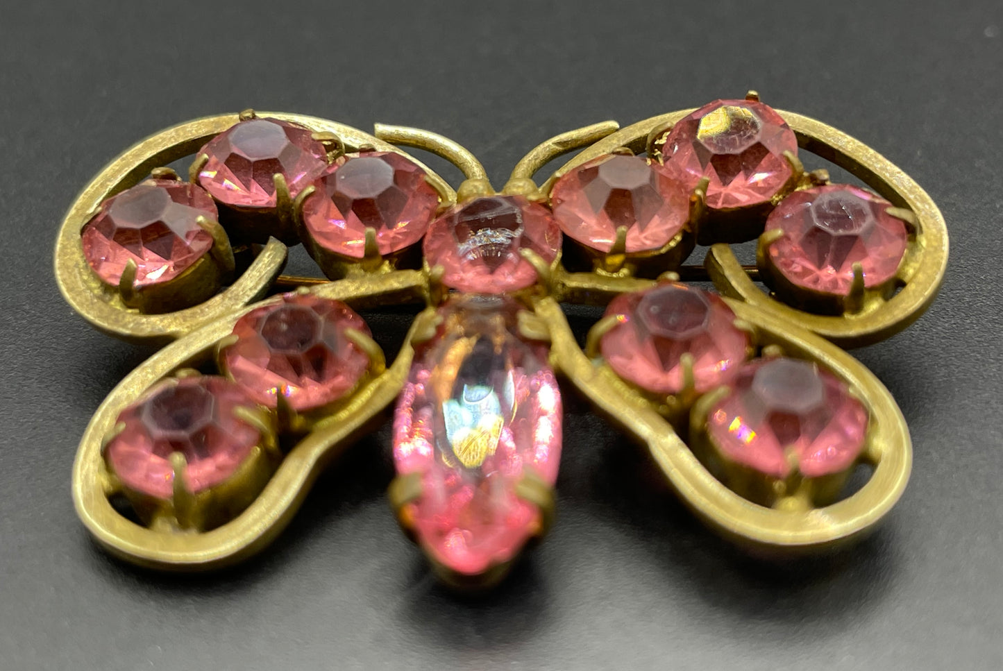 Vintage Art Deco Czech butterfly brooch, pink glass rhinestones, set open-backed in antique gold tone