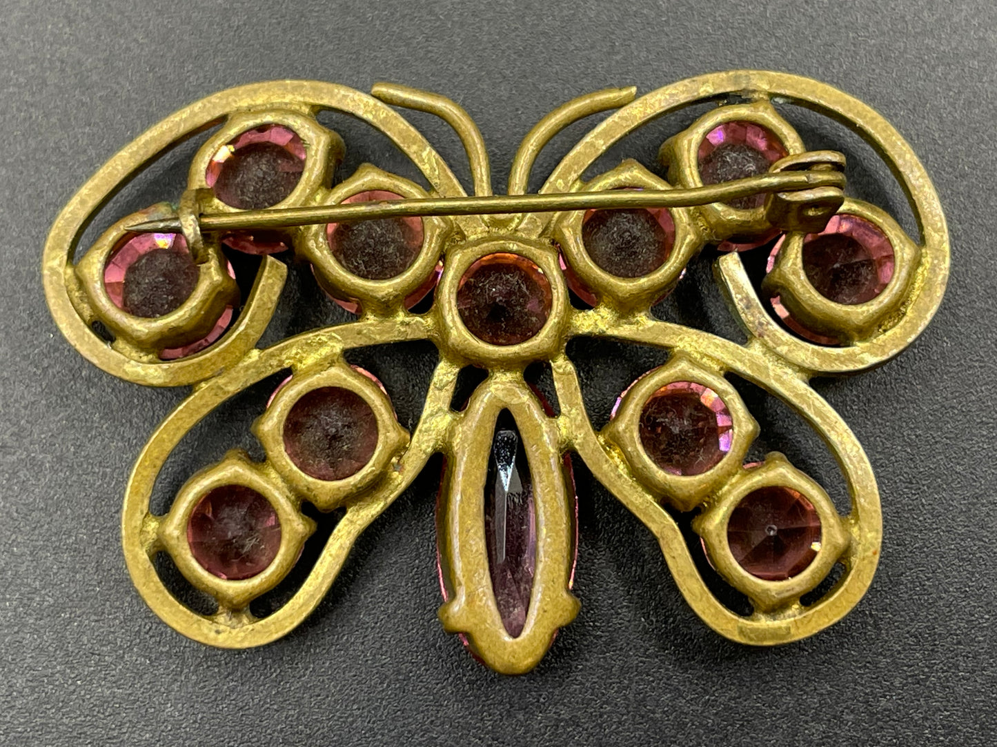 Vintage Art Deco Czech butterfly brooch, pink glass rhinestones, set open-backed in antique gold tone