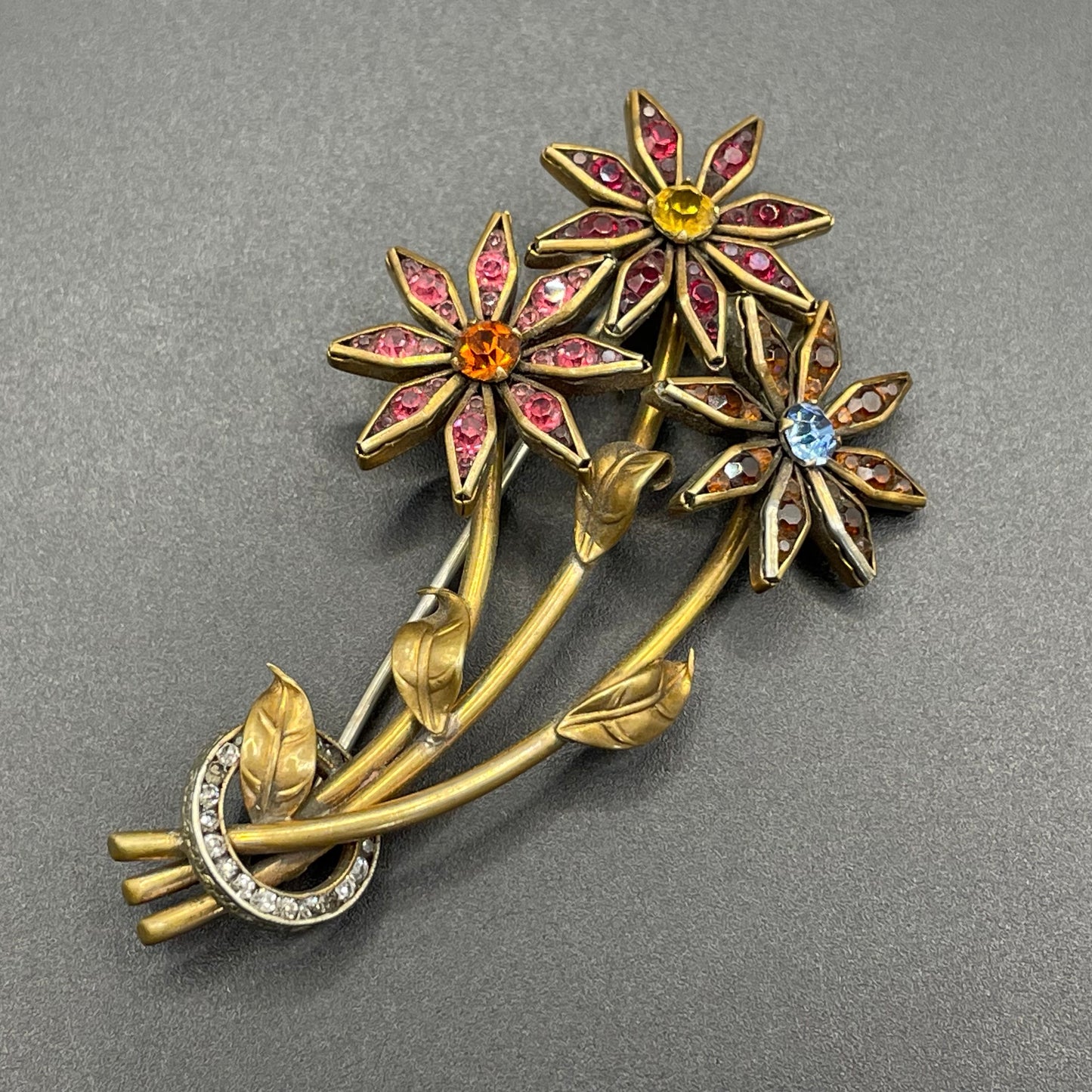 Vintage Schreiber & Hiller (unsigned) flower brooch, Art Deco channel set red, pink, orange, yellow, blue and clear paste rhinestones