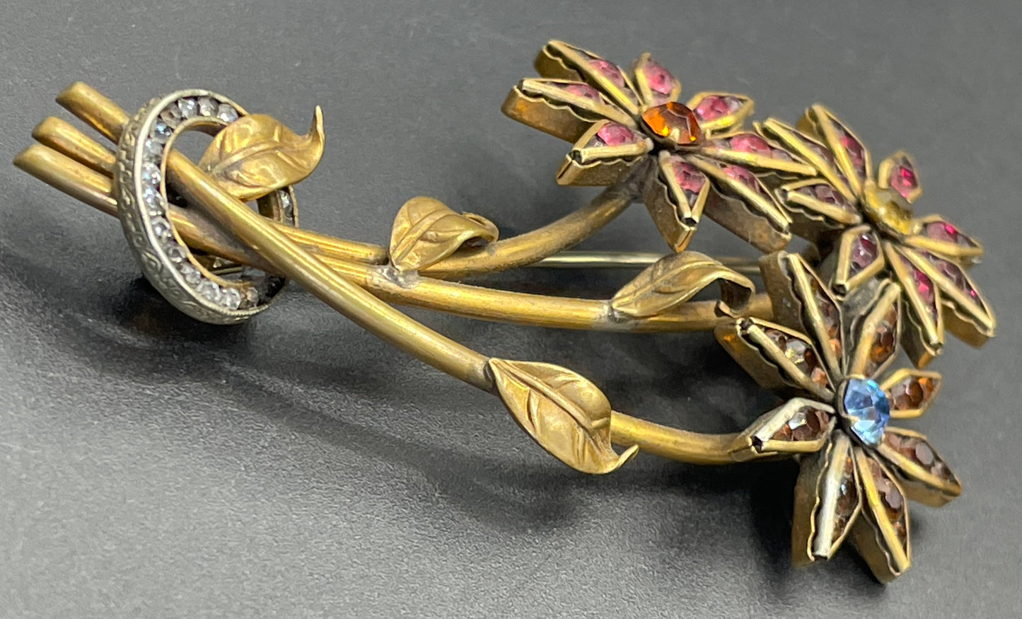 Vintage Schreiber & Hiller (unsigned) flower brooch, Art Deco channel set red, pink, orange, yellow, blue and clear paste rhinestones