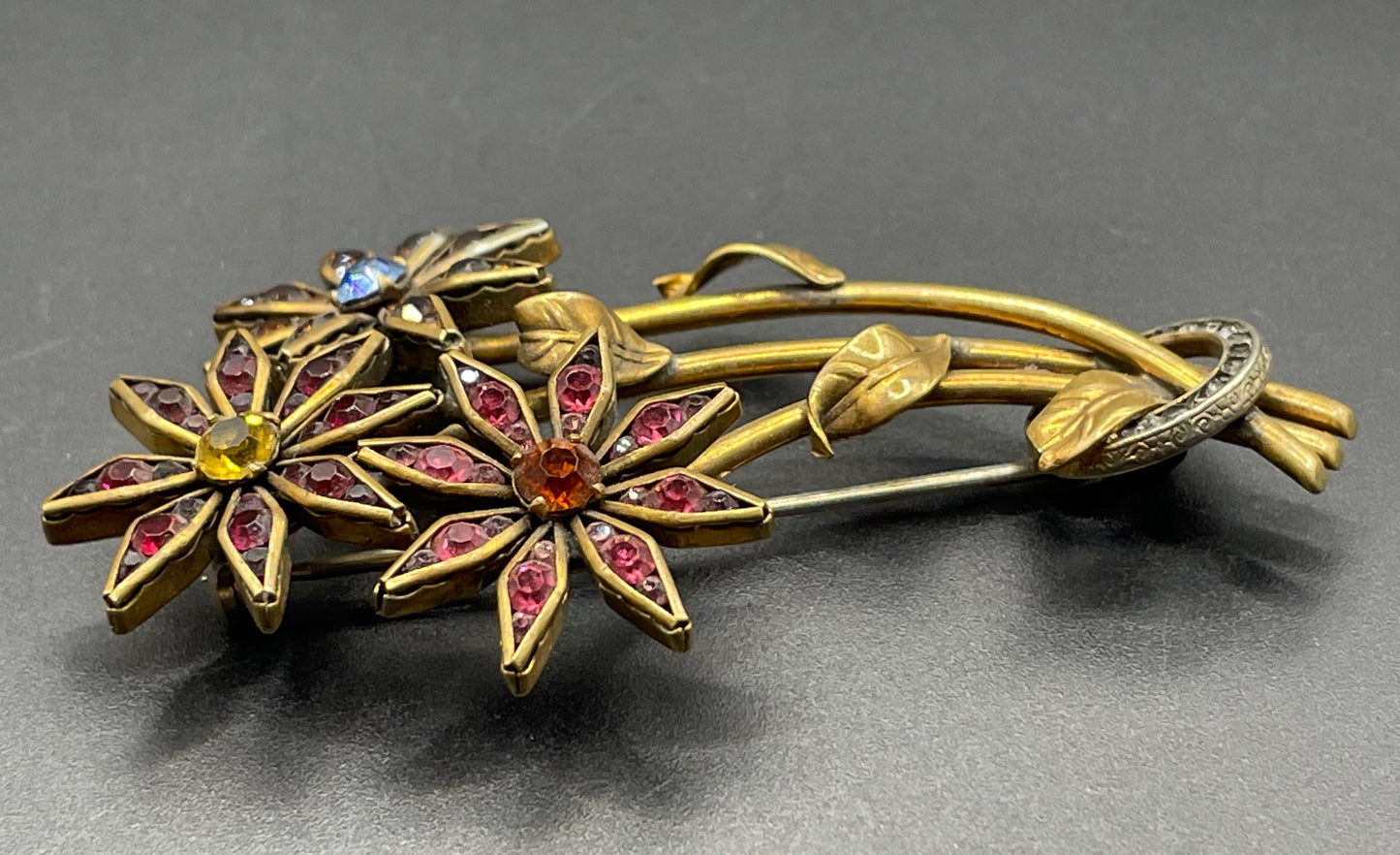 Vintage Schreiber & Hiller (unsigned) flower brooch, Art Deco channel set red, pink, orange, yellow, blue and clear paste rhinestones