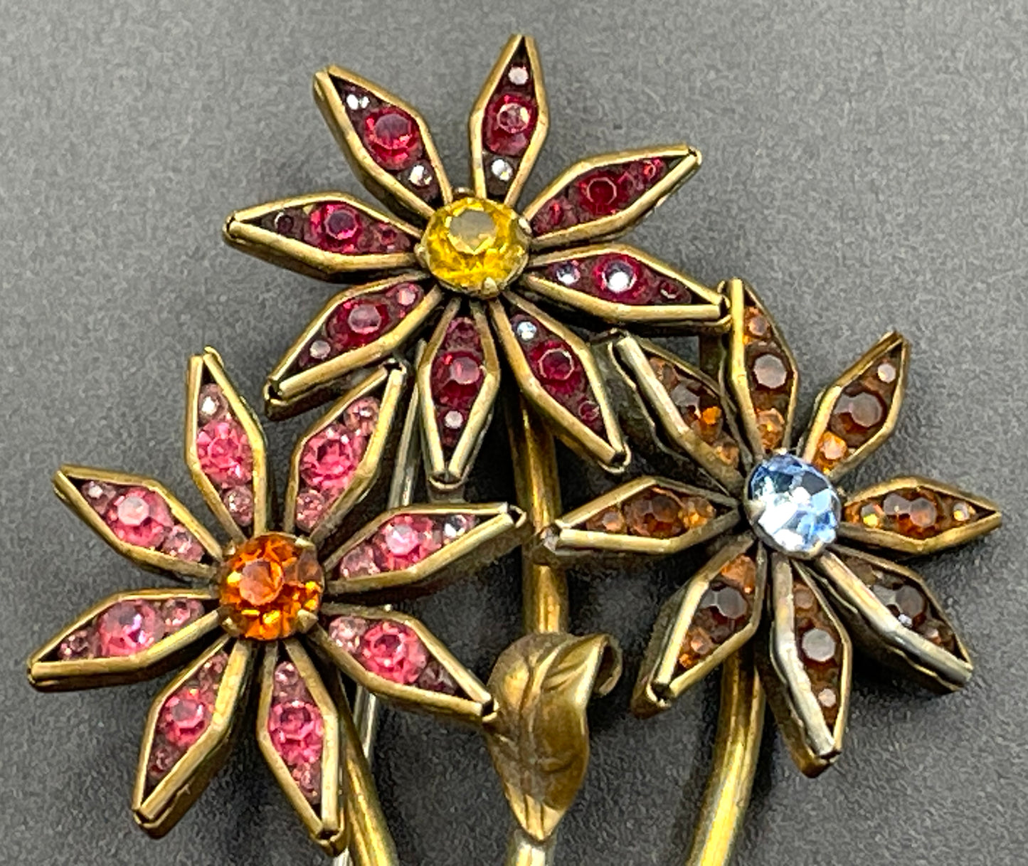 Vintage Schreiber & Hiller (unsigned) flower brooch, Art Deco channel set red, pink, orange, yellow, blue and clear paste rhinestones