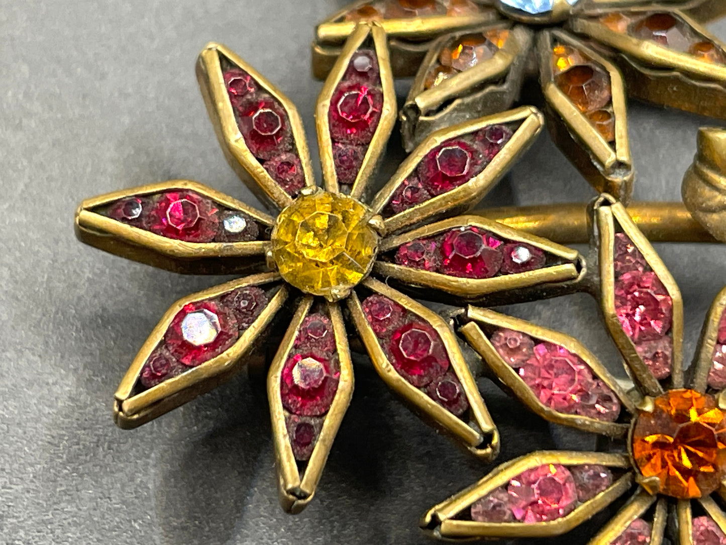 Vintage Schreiber & Hiller (unsigned) flower brooch, Art Deco channel set red, pink, orange, yellow, blue and clear paste rhinestones