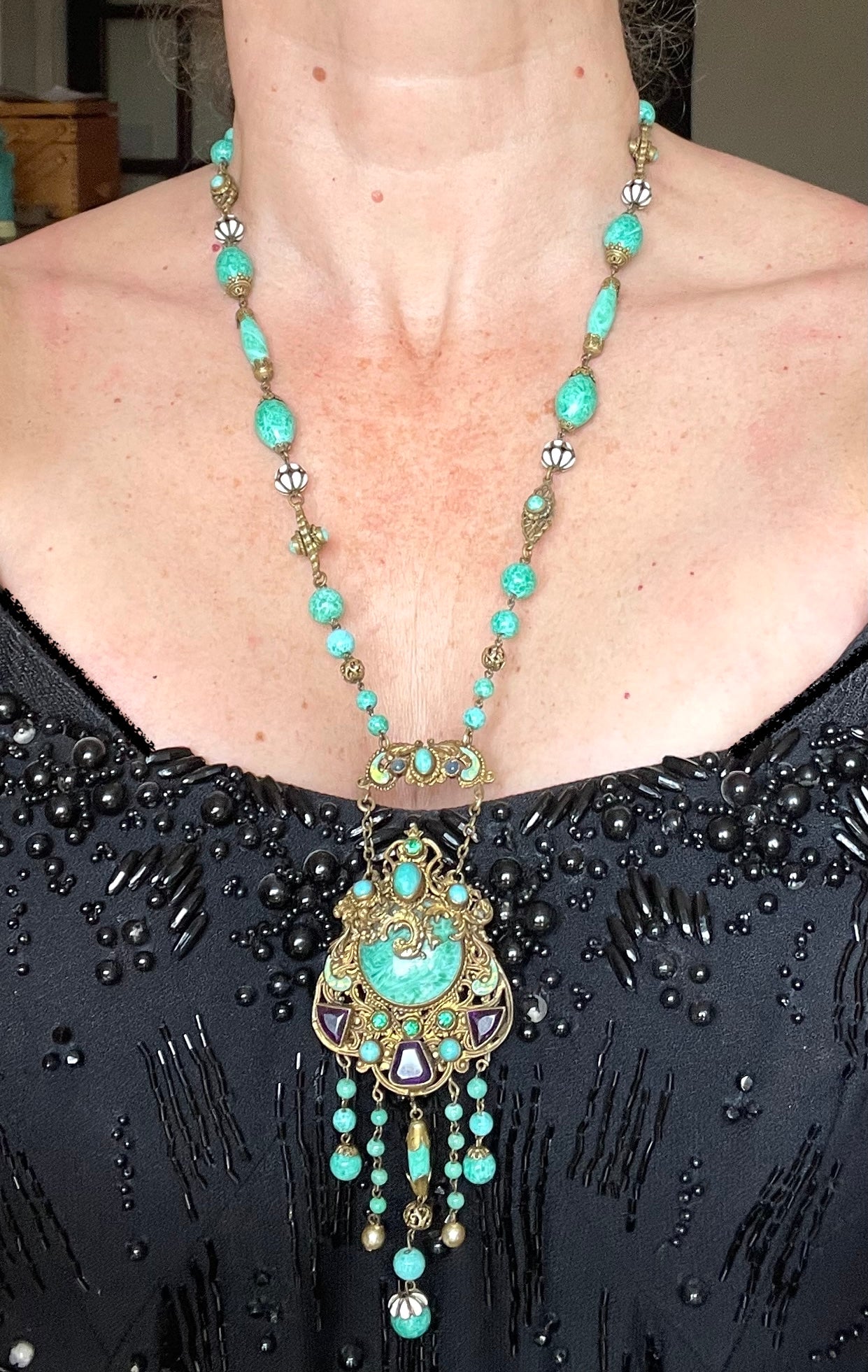 Vintage Neiger brothers long flapper necklace with ornate beads, enamel and lariat panels, green 'Peking' glass, green & purple rhinestones