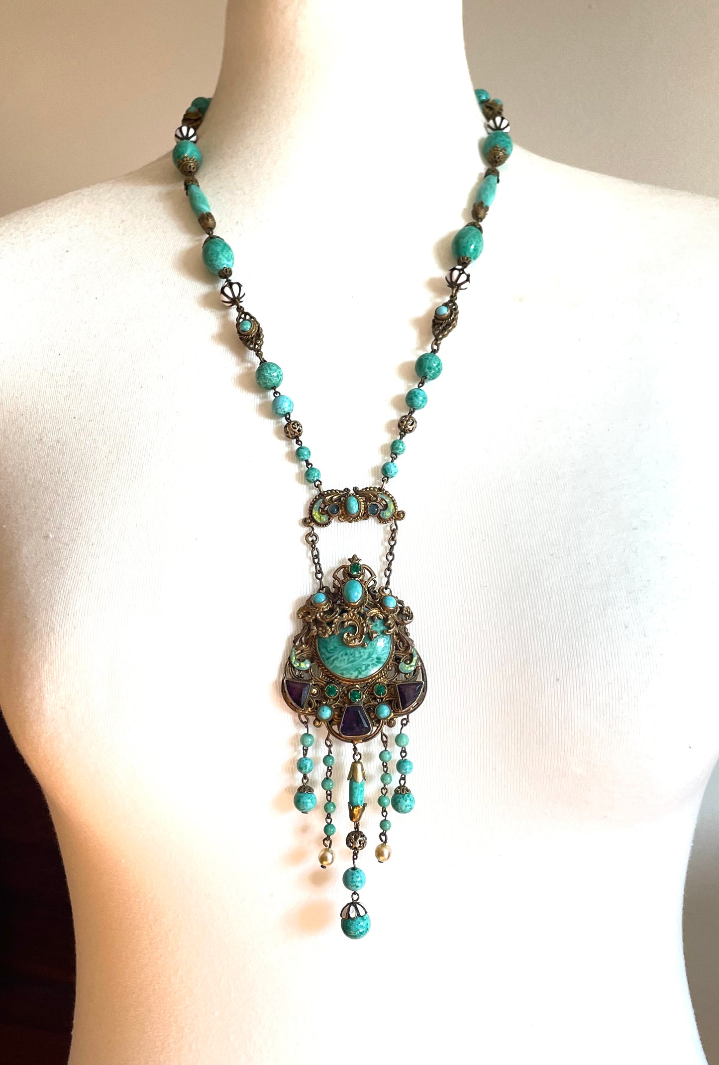 Vintage Neiger brothers long flapper necklace with ornate beads, enamel and lariat panels, green 'Peking' glass, green & purple rhinestones