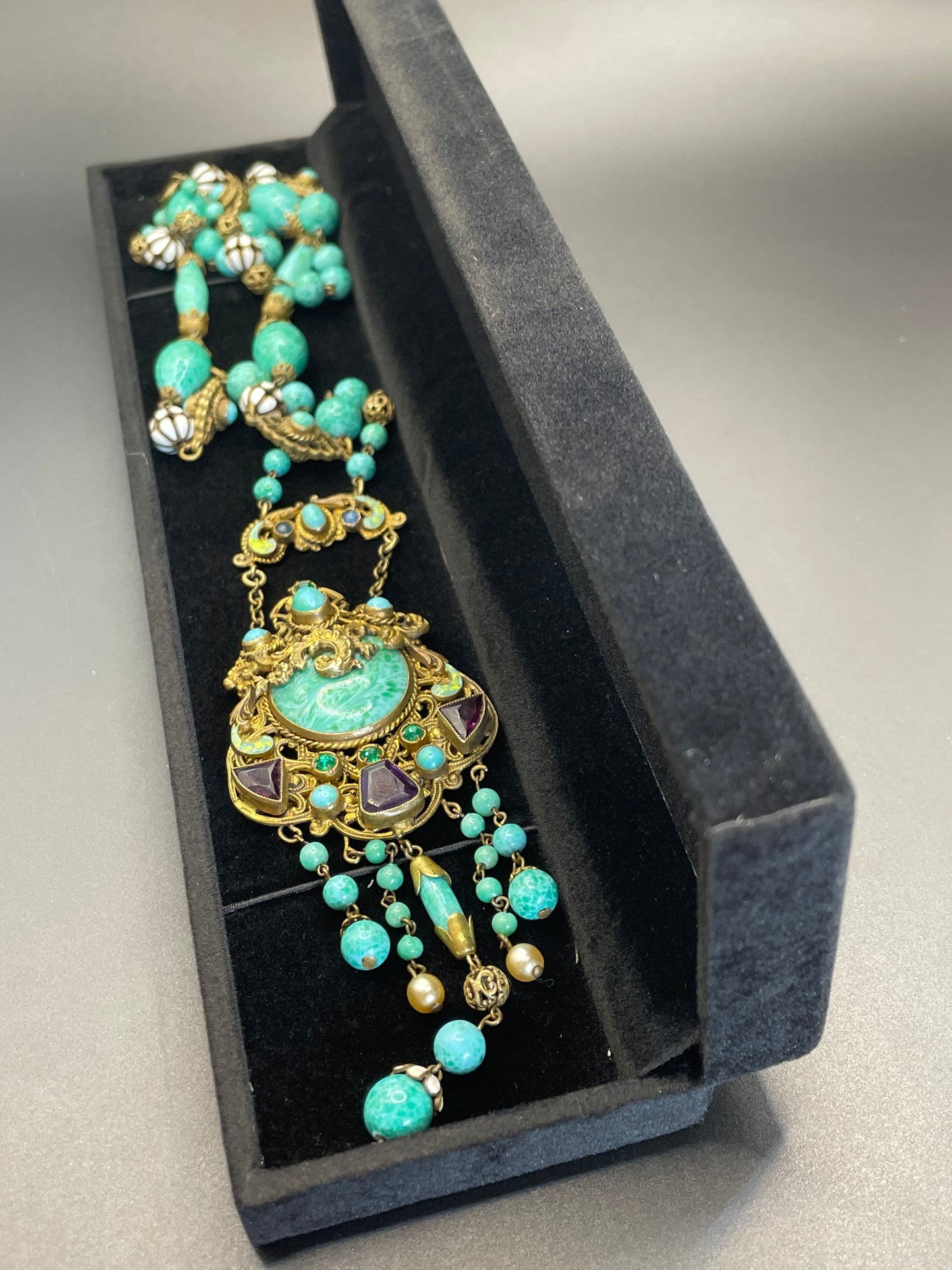 Vintage Neiger brothers long flapper necklace with ornate beads, enamel and lariat panels, green 'Peking' glass, green & purple rhinestones