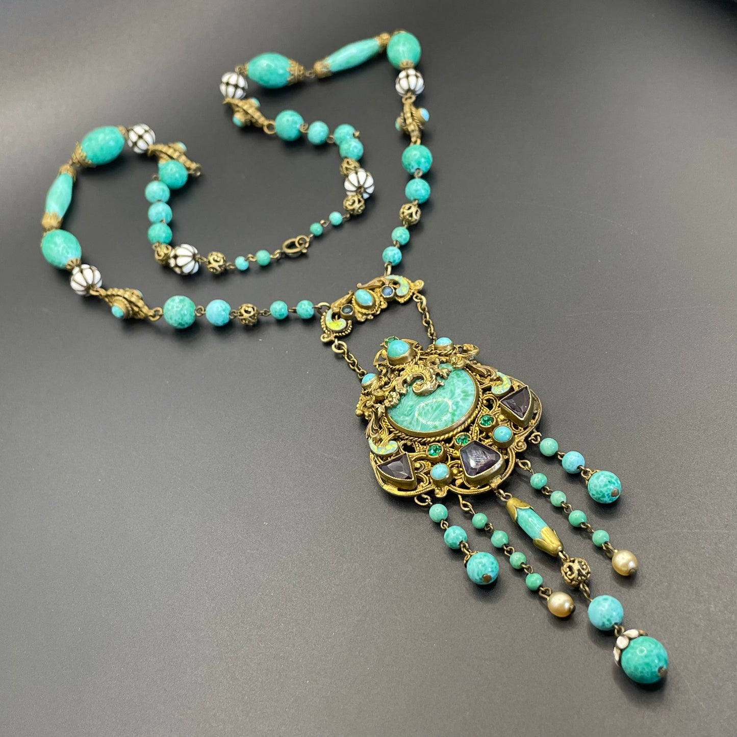 Vintage Neiger brothers long flapper necklace with ornate beads, enamel and lariat panels, green 'Peking' glass, green & purple rhinestones