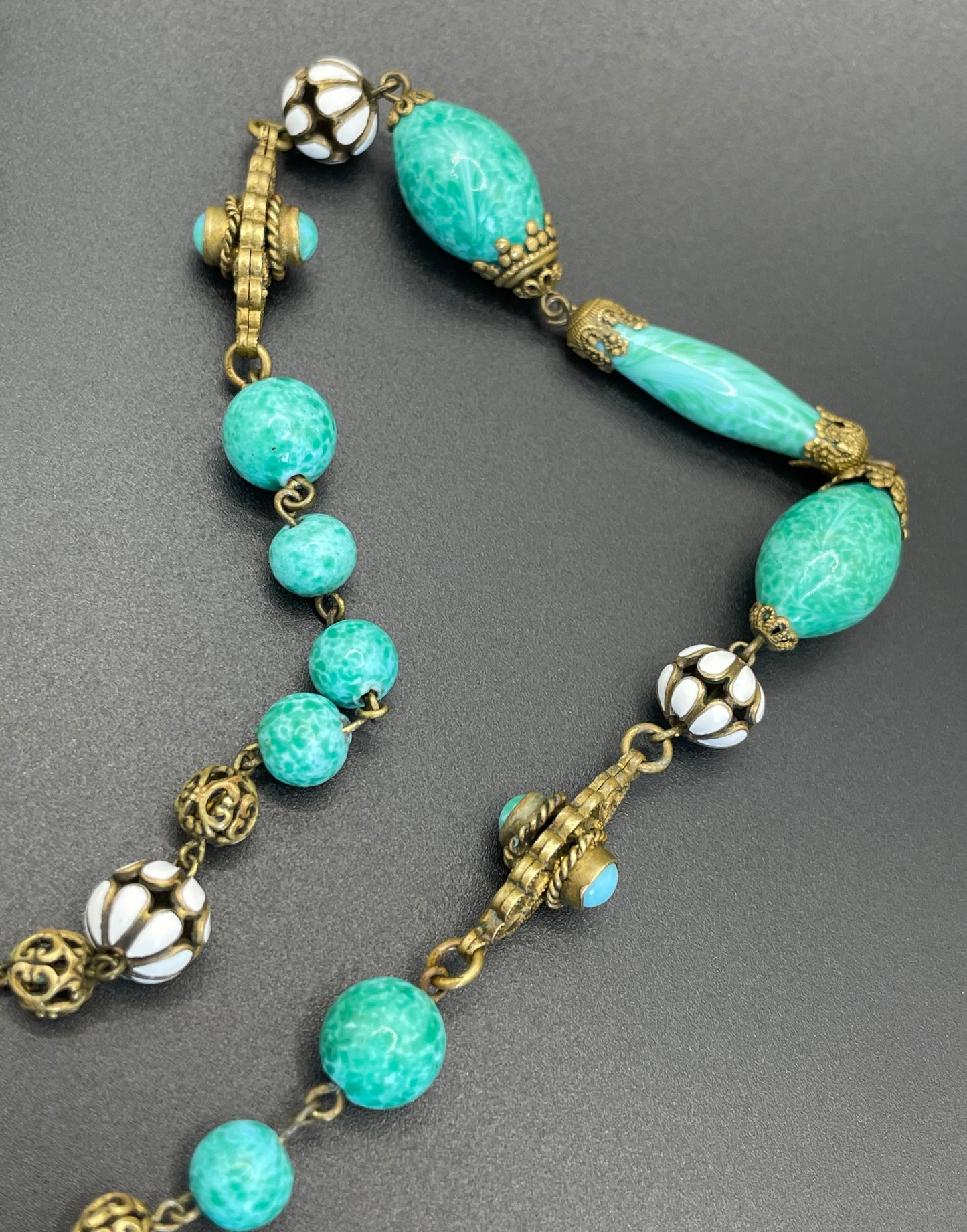 Vintage Neiger brothers long flapper necklace with ornate beads, enamel and lariat panels, green 'Peking' glass, green & purple rhinestones
