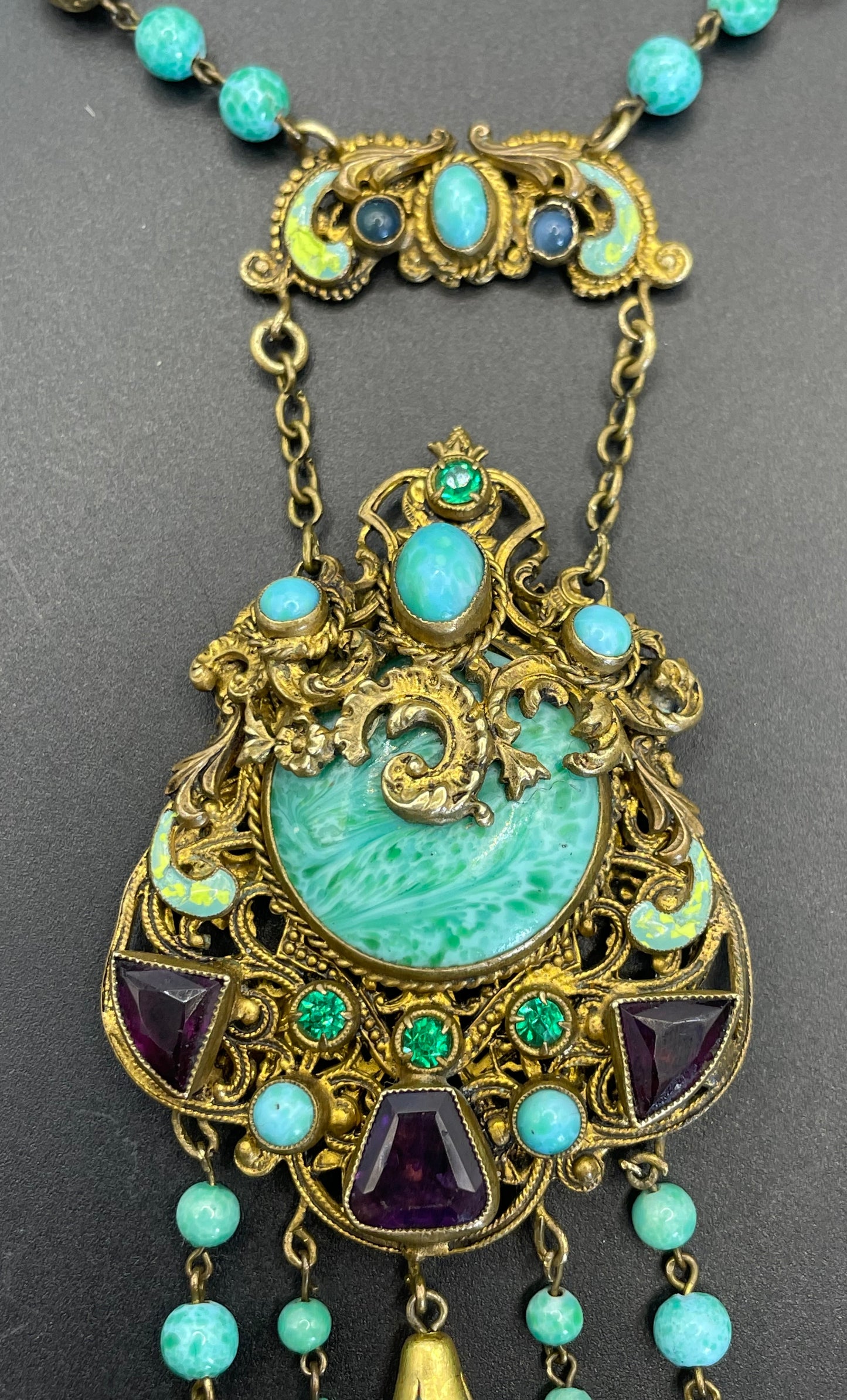 Vintage Neiger brothers long flapper necklace with ornate beads, enamel and lariat panels, green 'Peking' glass, green & purple rhinestones