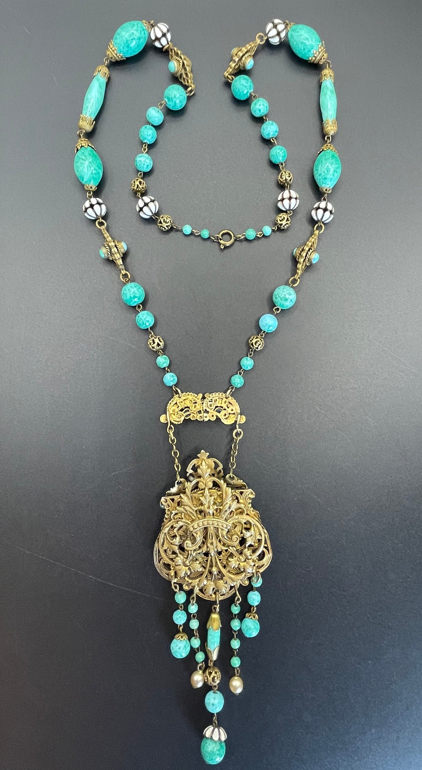 Vintage Neiger brothers long flapper necklace with ornate beads, enamel and lariat panels, green 'Peking' glass, green & purple rhinestones
