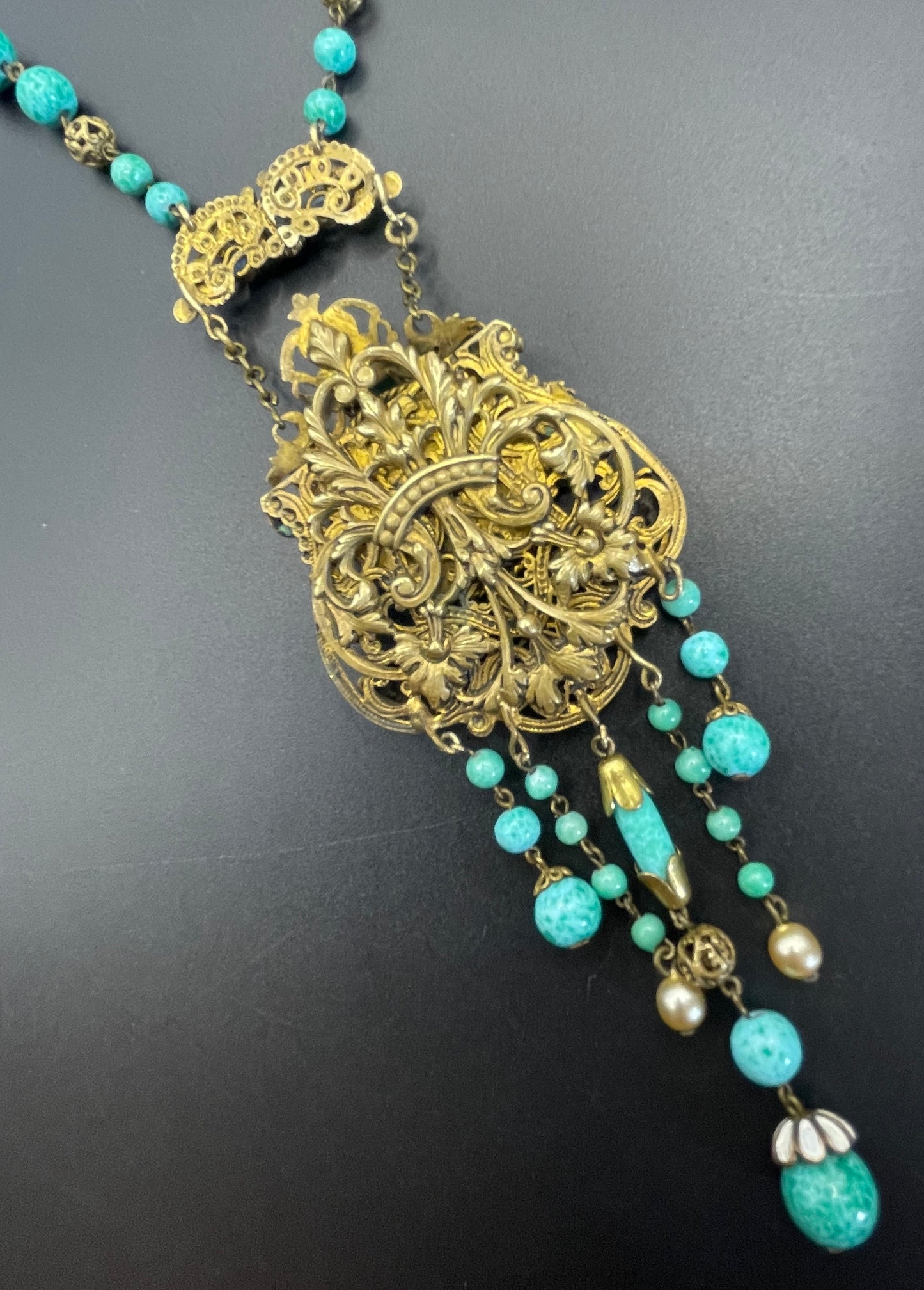 Vintage Neiger brothers long flapper necklace with ornate beads, enamel and lariat panels, green 'Peking' glass, green & purple rhinestones