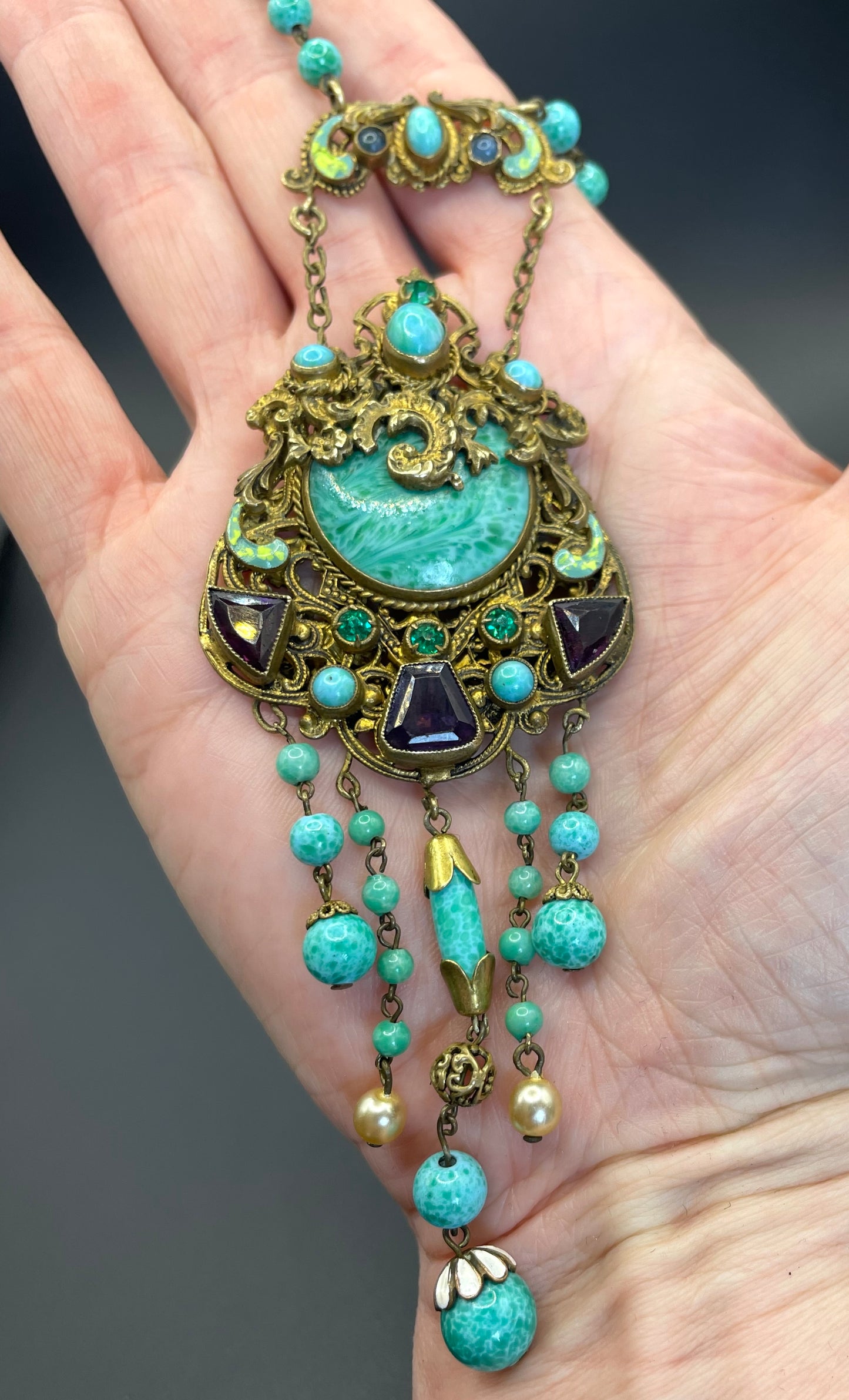 Vintage Neiger brothers long flapper necklace with ornate beads, enamel and lariat panels, green 'Peking' glass, green & purple rhinestones