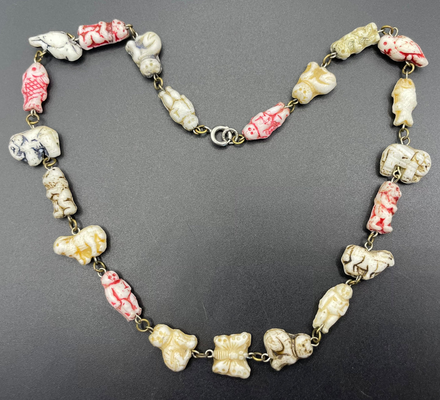 Vintage moulded 'custard' glass animal, bird, butterfly, fish & people shaped beaded necklace, rare Czech pressed glass with UV sensitivity