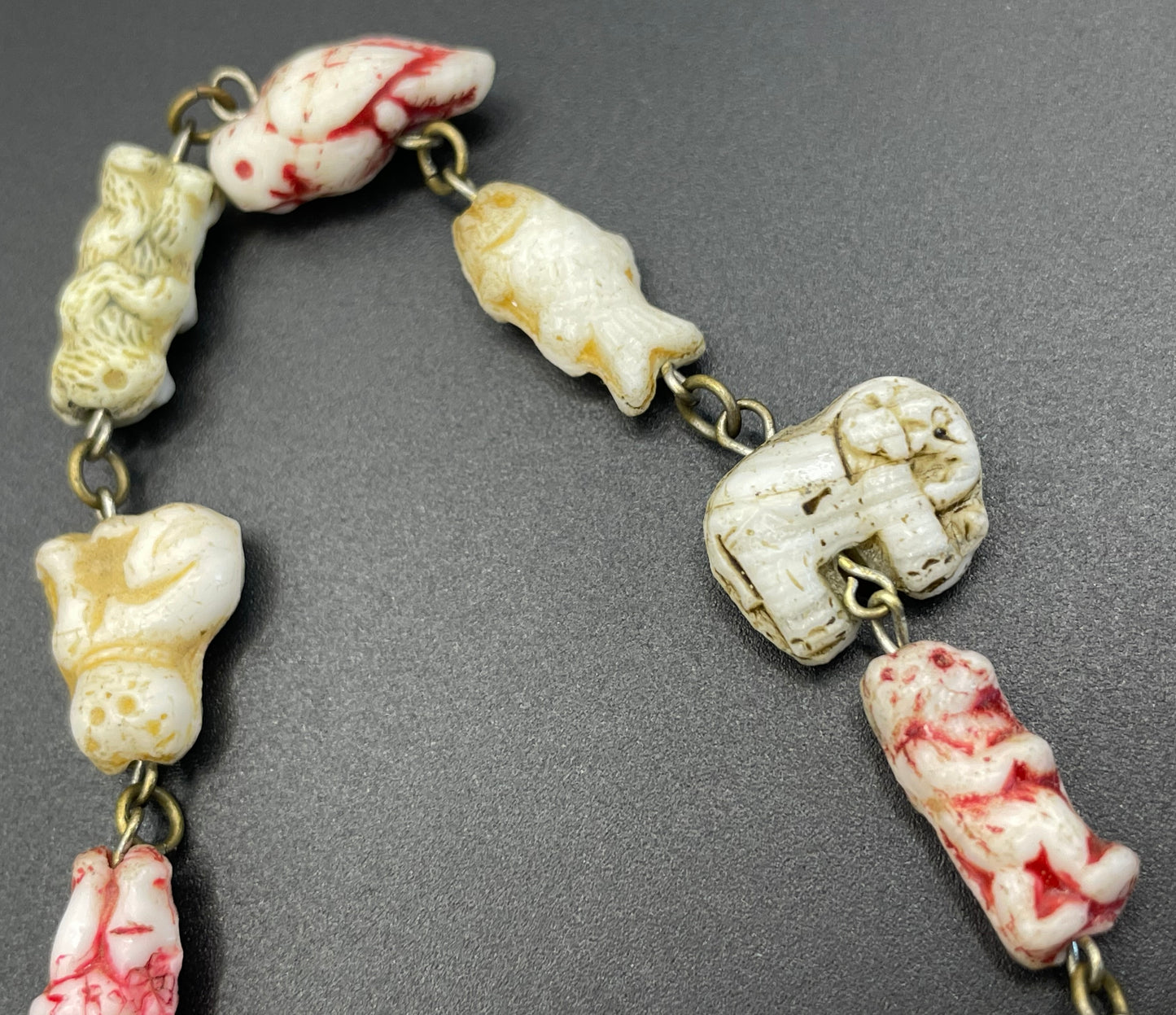 Vintage moulded 'custard' glass animal, bird, butterfly, fish & people shaped beaded necklace, rare Czech pressed glass with UV sensitivity