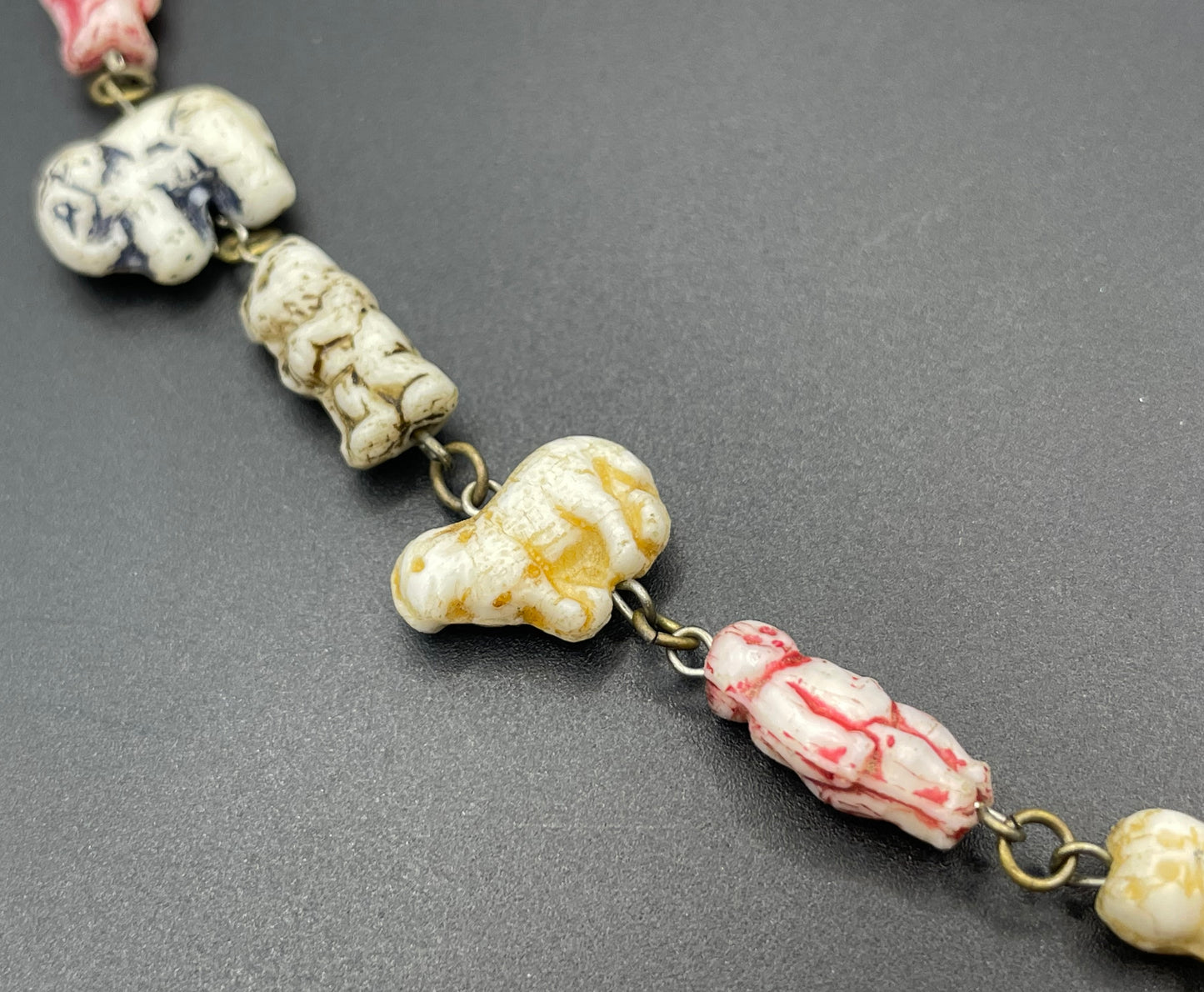 Vintage moulded 'custard' glass animal, bird, butterfly, fish & people shaped beaded necklace, rare Czech pressed glass with UV sensitivity
