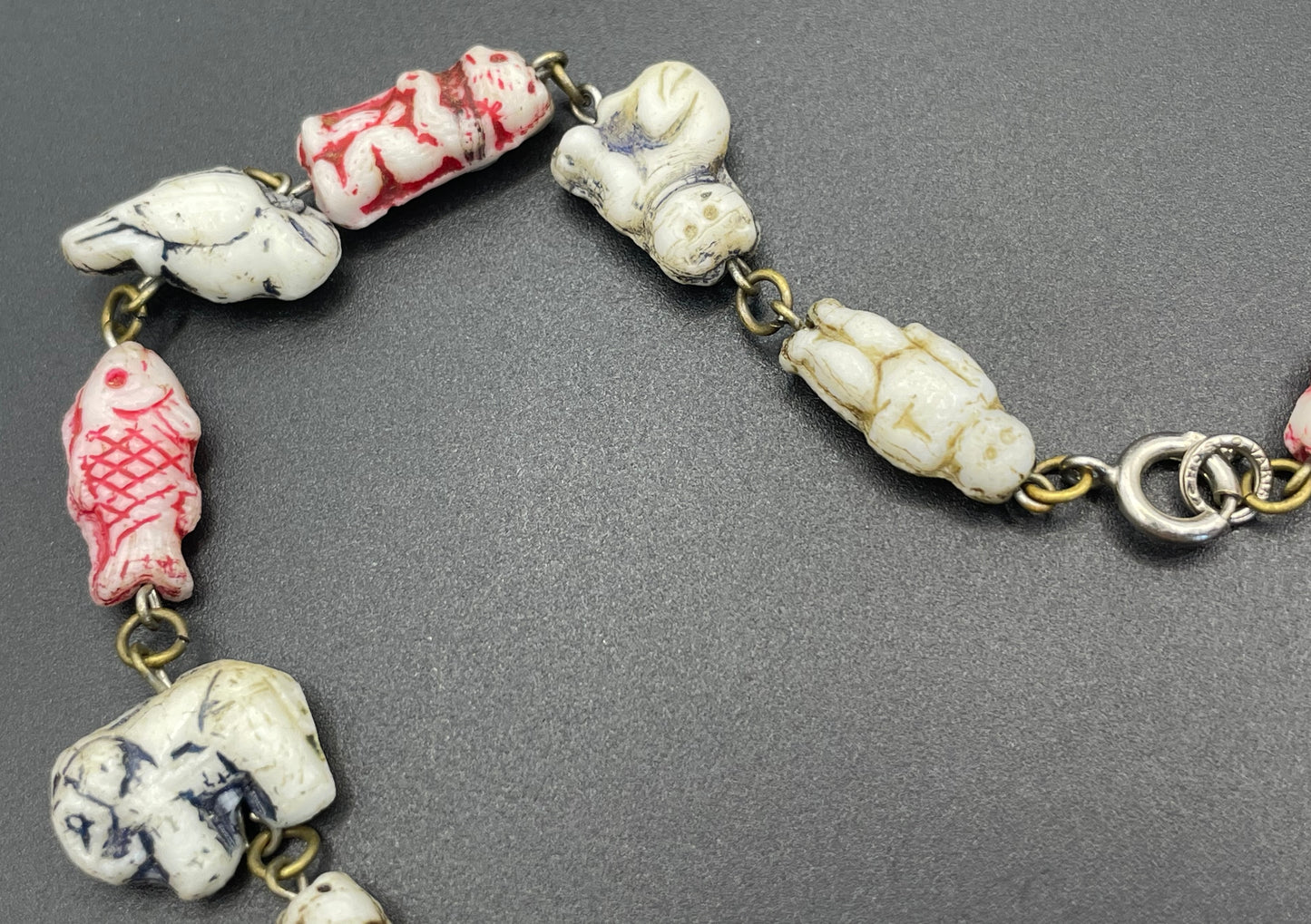 Vintage moulded 'custard' glass animal, bird, butterfly, fish & people shaped beaded necklace, rare Czech pressed glass with UV sensitivity